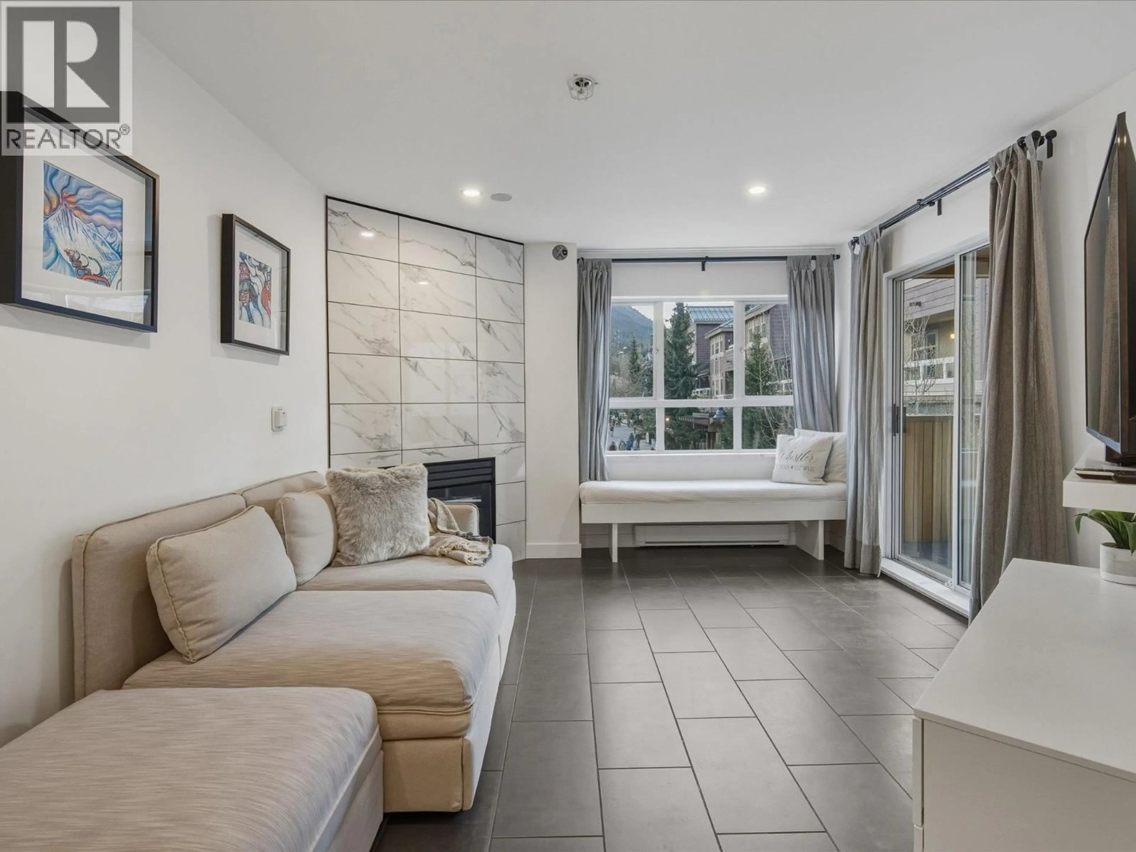 Living room with furniture, ceramic/tile floor for 243 - 4350 LORIMER ROAD, Whistler British Columbia V8E1A5