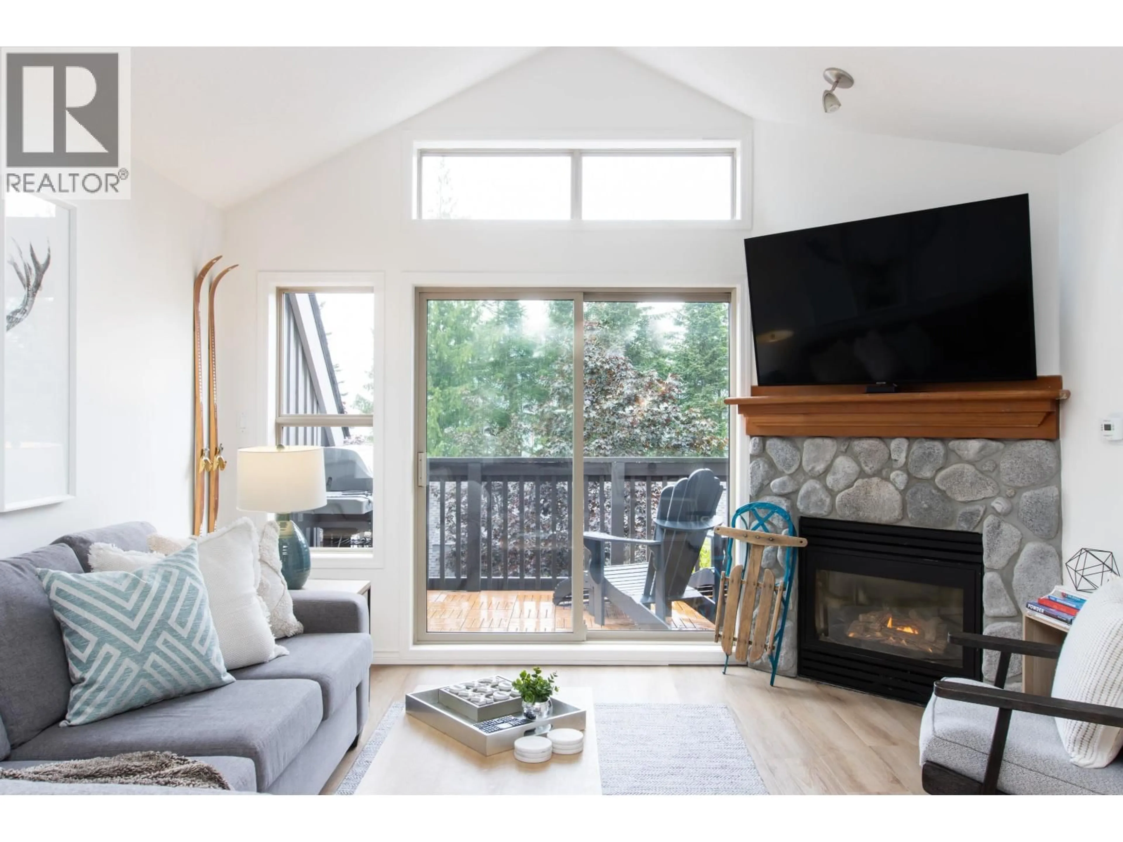 Living room with furniture, wood/laminate floor for 7 - 4890 PAINTED CLIFF ROAD, Whistler British Columbia V8E1C9