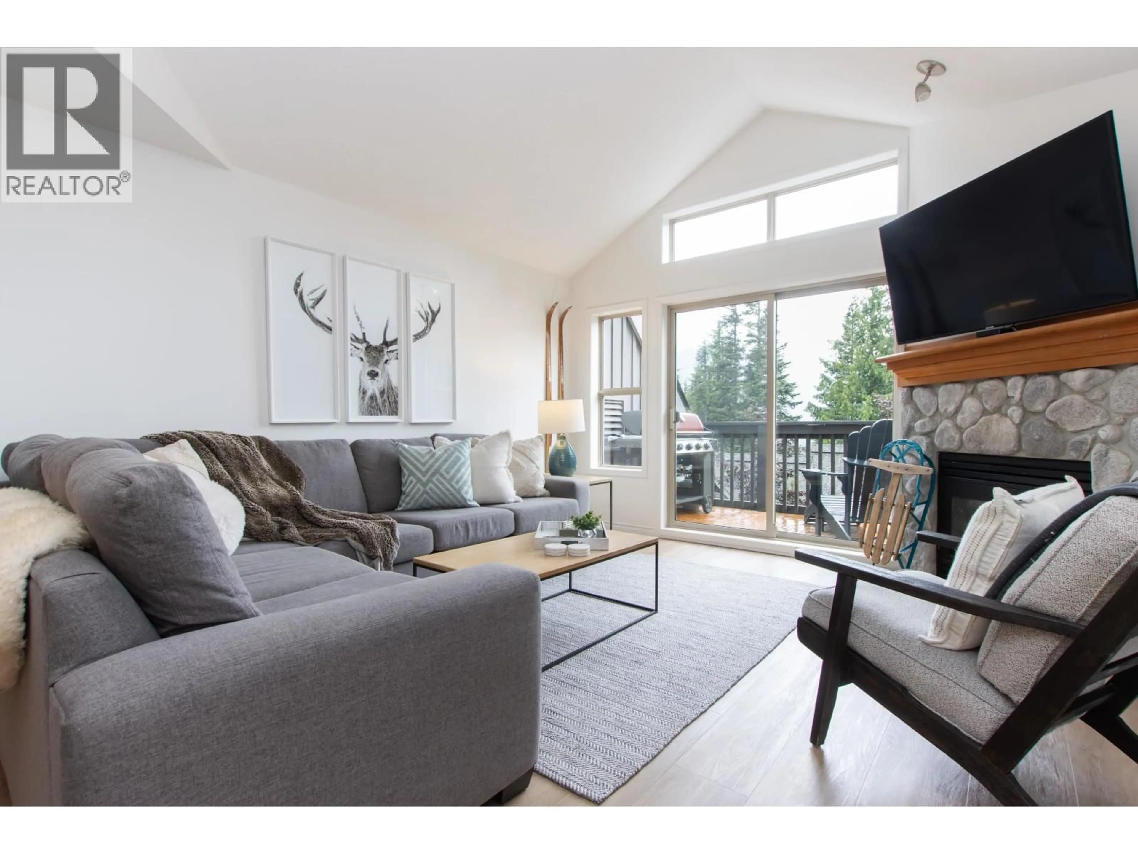 Living room with furniture, wood/laminate floor for 7 - 4890 PAINTED CLIFF ROAD, Whistler British Columbia V8E1C9