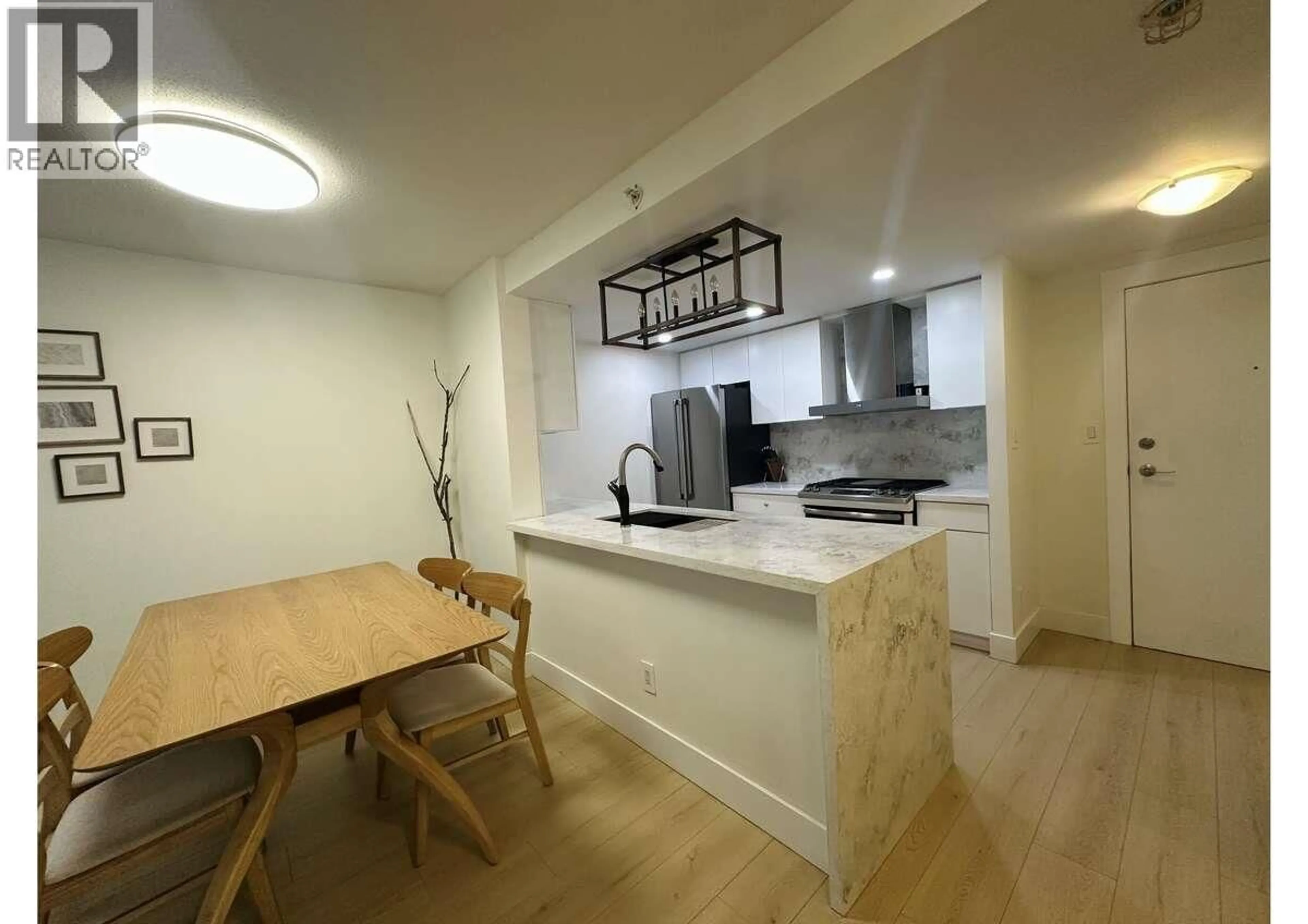 Open concept kitchen, unknown for 202 - 1033 MARINASIDE CRESCENT, Vancouver British Columbia V6Z3A3