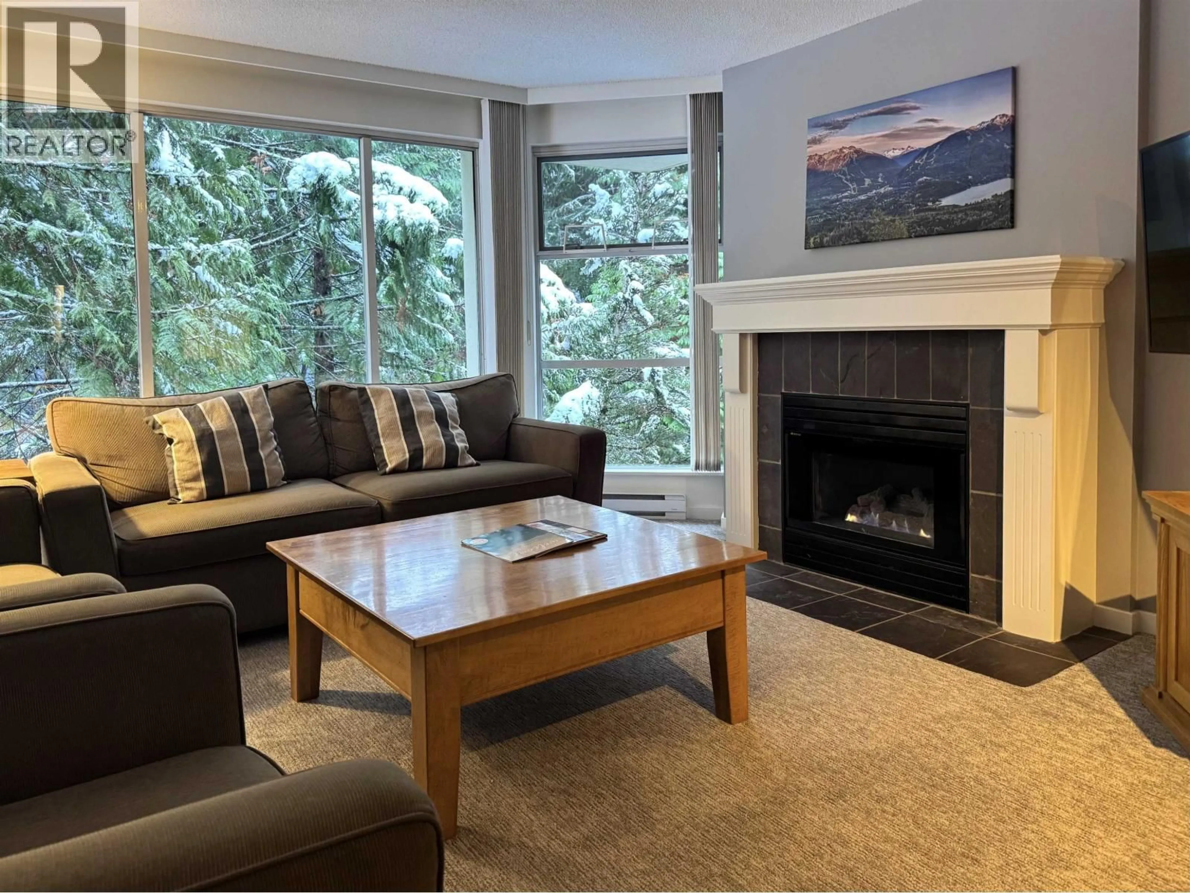 Living room with furniture, wood/laminate floor for 420 w49 - 4910 SPEARHEAD PLACE, Whistler British Columbia V8E1G1