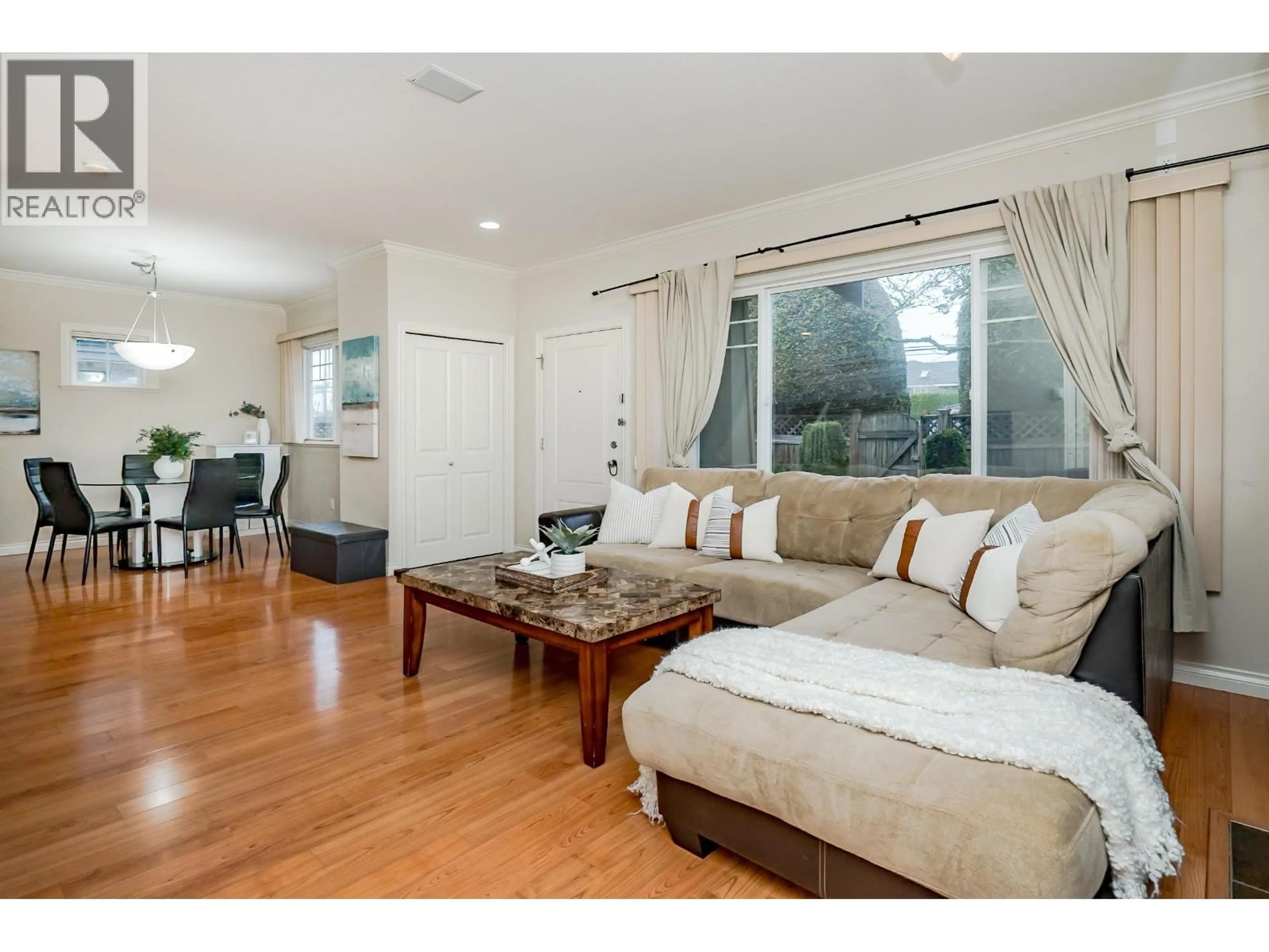 Living room with furniture, wood/laminate floor for 10 - 7060 BRIDGE STREET, Richmond British Columbia V6Y2S7