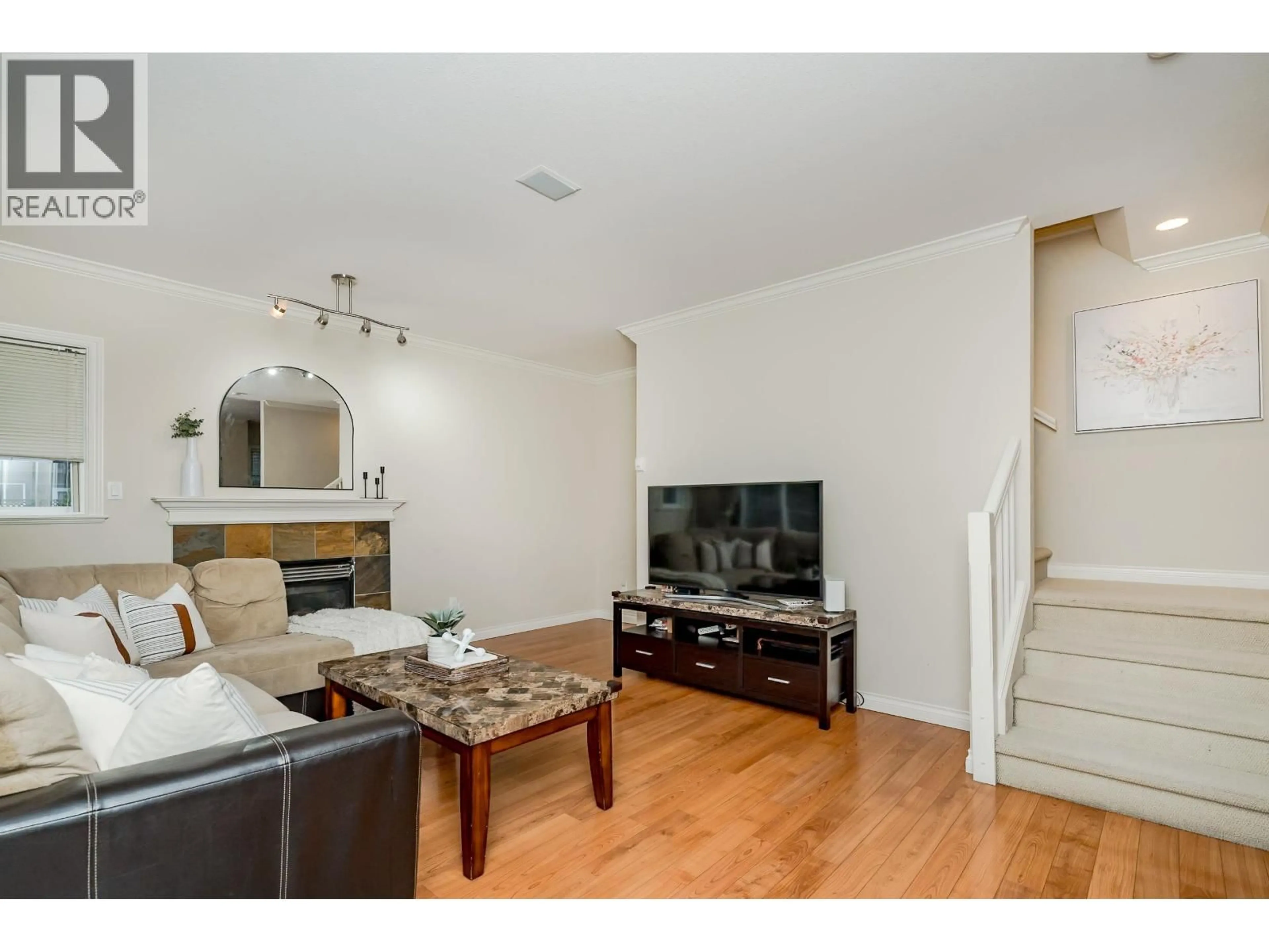 Living room with furniture, wood/laminate floor for 10 - 7060 BRIDGE STREET, Richmond British Columbia V6Y2S7