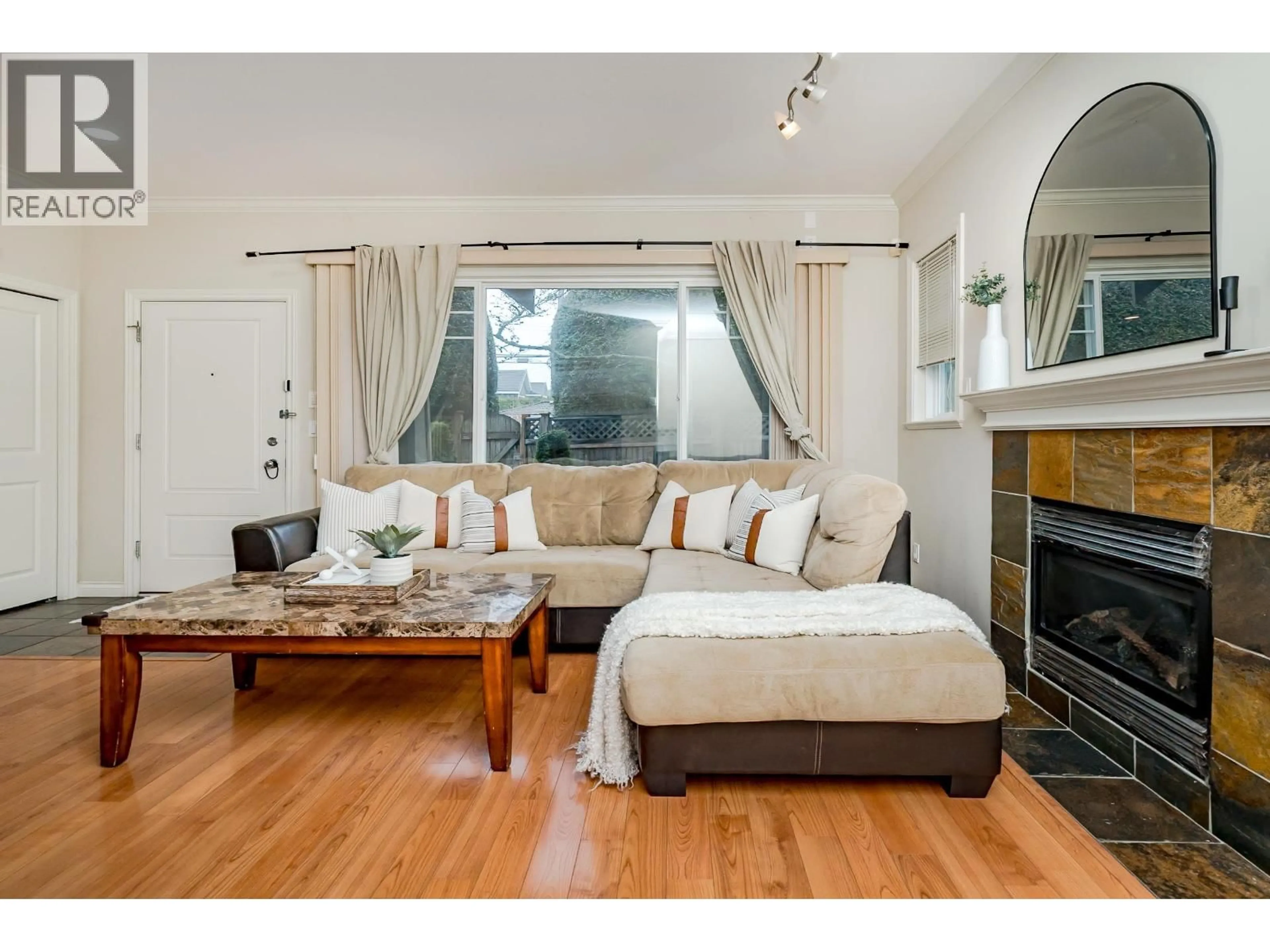 Living room with furniture, wood/laminate floor for 10 - 7060 BRIDGE STREET, Richmond British Columbia V6Y2S7