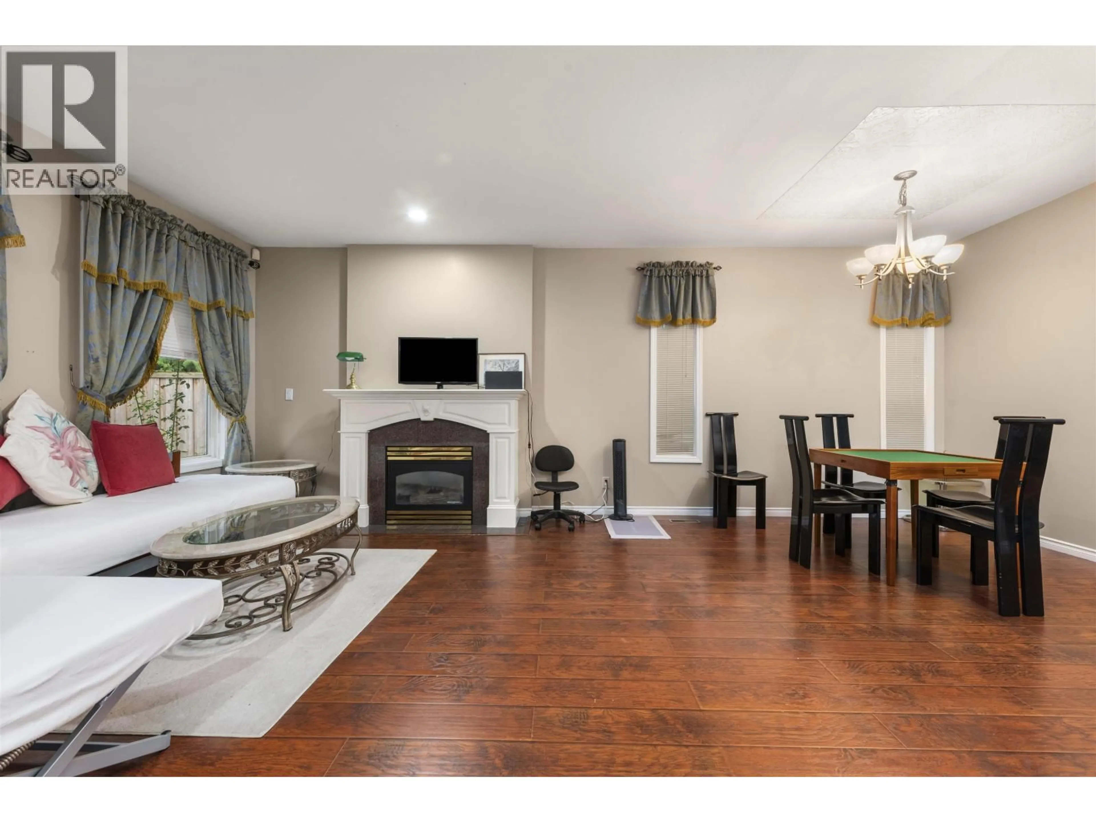 Living room with furniture, wood/laminate floor for 10231 CAMBIE ROAD, Richmond British Columbia V6X4A4