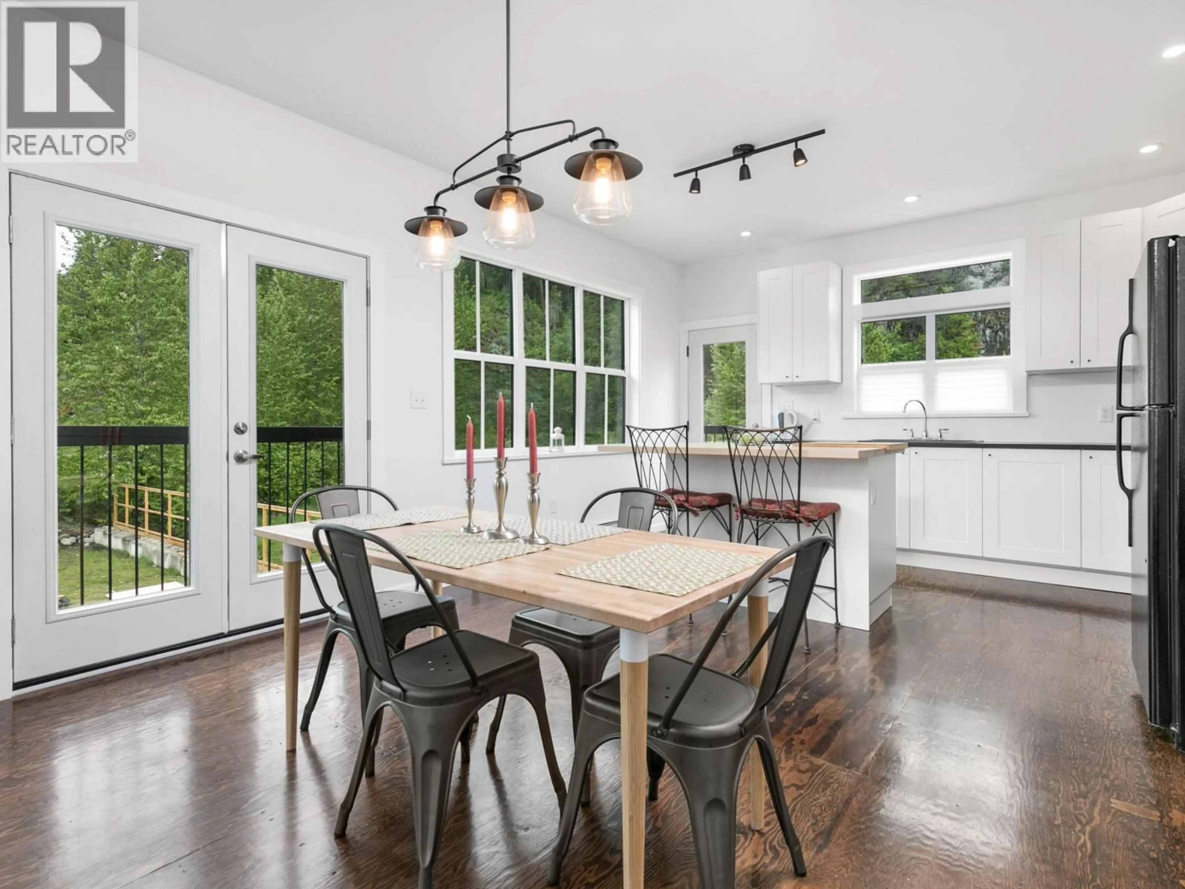 Open concept kitchen, wood/laminate floor for 1926 STONECUTTER PLACE, Pemberton British Columbia V0N2L0
