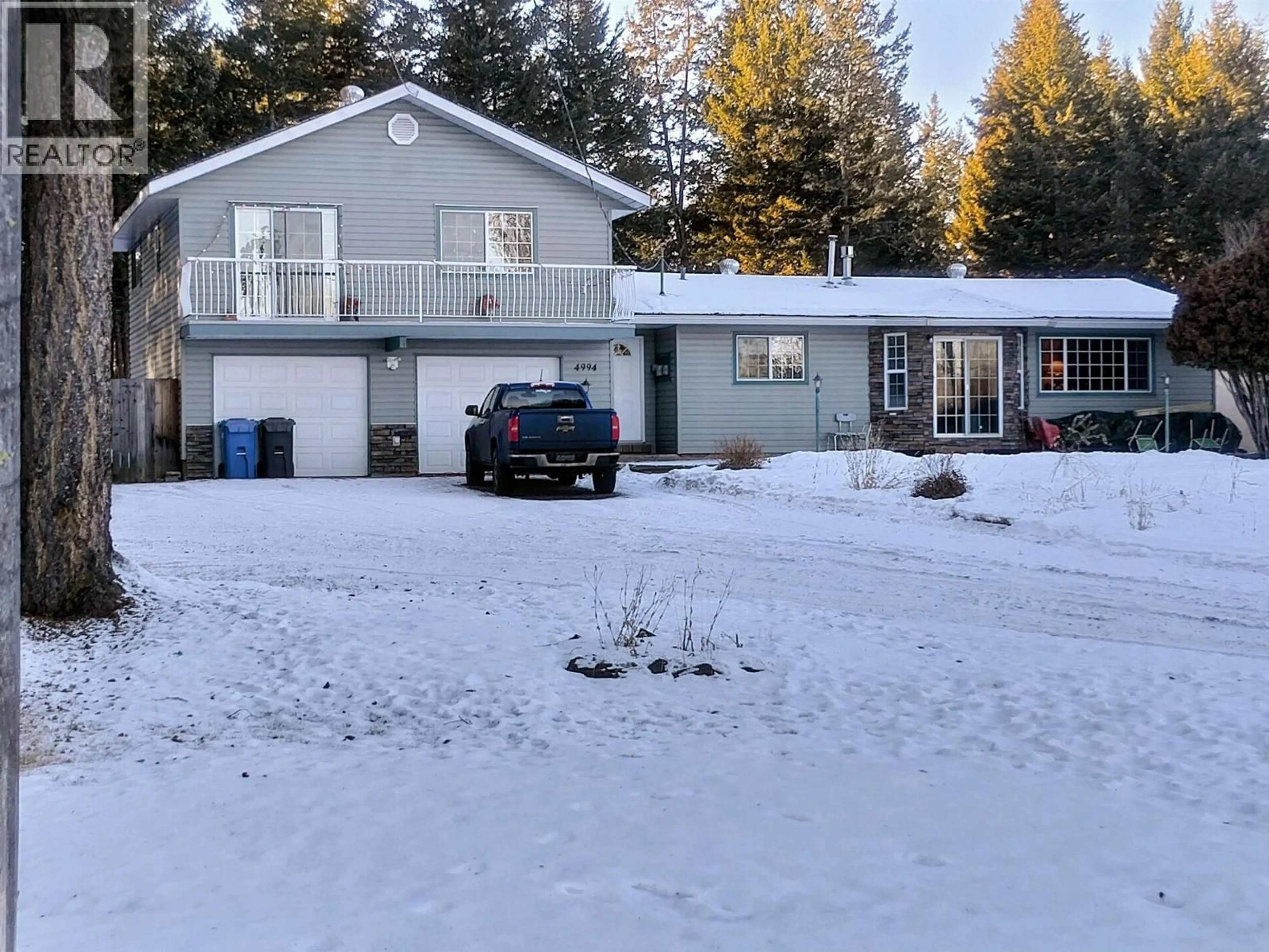 A pic from outside/outdoor area/front of a property/back of a property/a pic from drone, street for 4994 DONSLEEQUA ROAD, 108 Mile Ranch British Columbia V0K2Z0