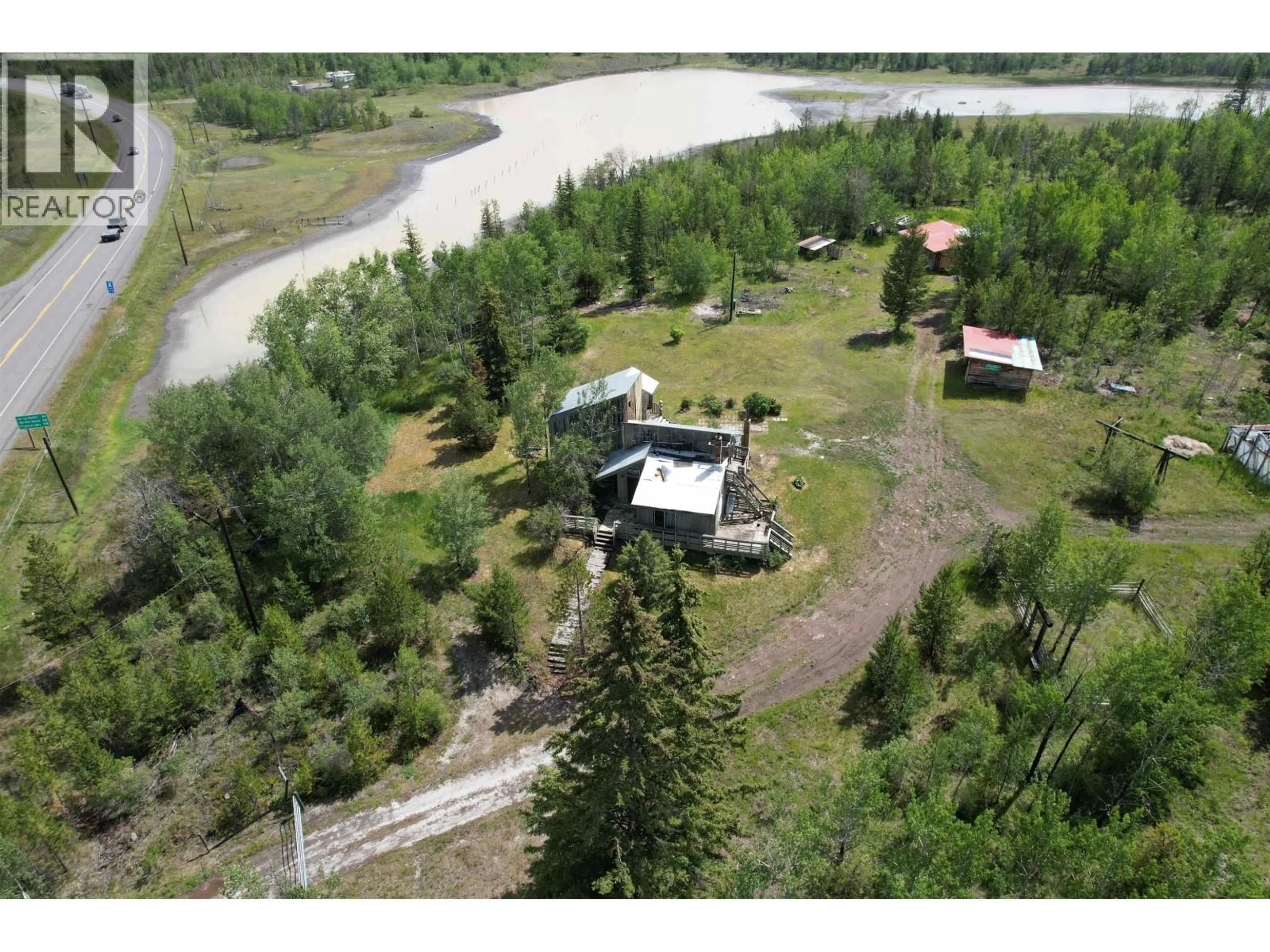 A pic from outside/outdoor area/front of a property/back of a property/a pic from drone, water/lake/river/ocean view for 1436 CARIBOO 97 HIGHWAY, 70 Mile House British Columbia V0K1K0