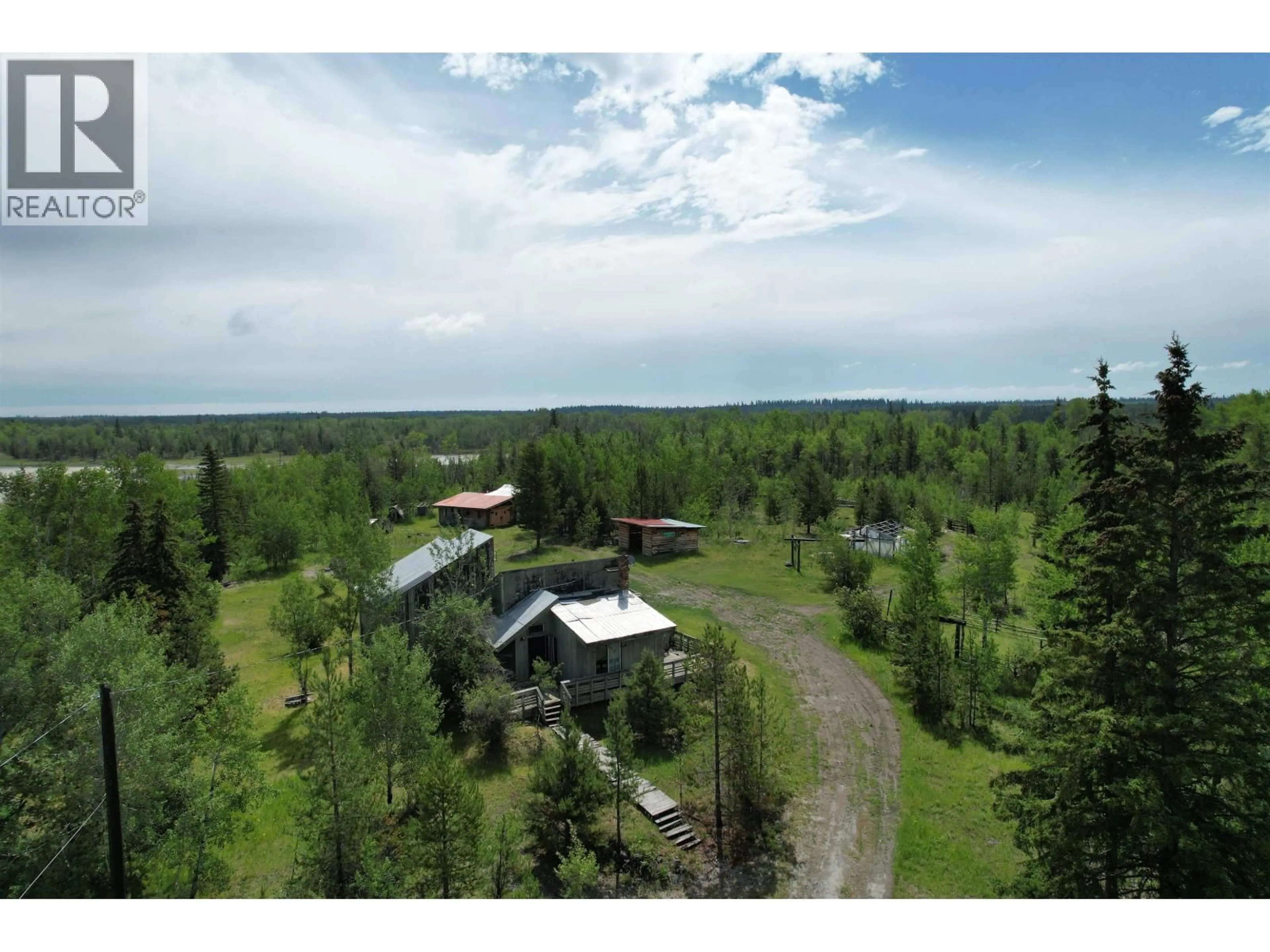 A pic from outside/outdoor area/front of a property/back of a property/a pic from drone, forest/trees view for 1436 CARIBOO 97 HIGHWAY, 70 Mile House British Columbia V0K1K0