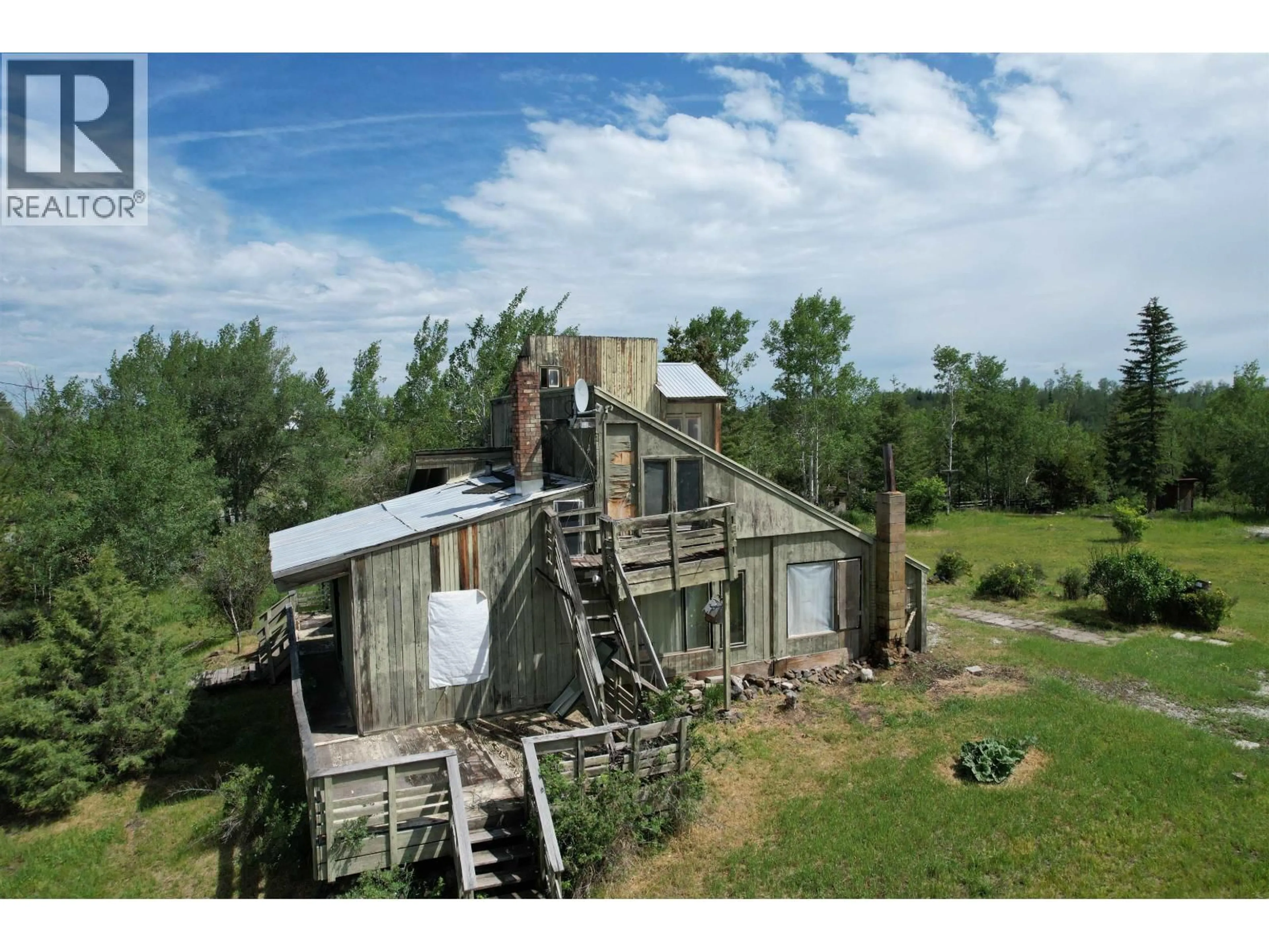 A pic from outside/outdoor area/front of a property/back of a property/a pic from drone, building for 1436 CARIBOO 97 HIGHWAY, 70 Mile House British Columbia V0K1K0