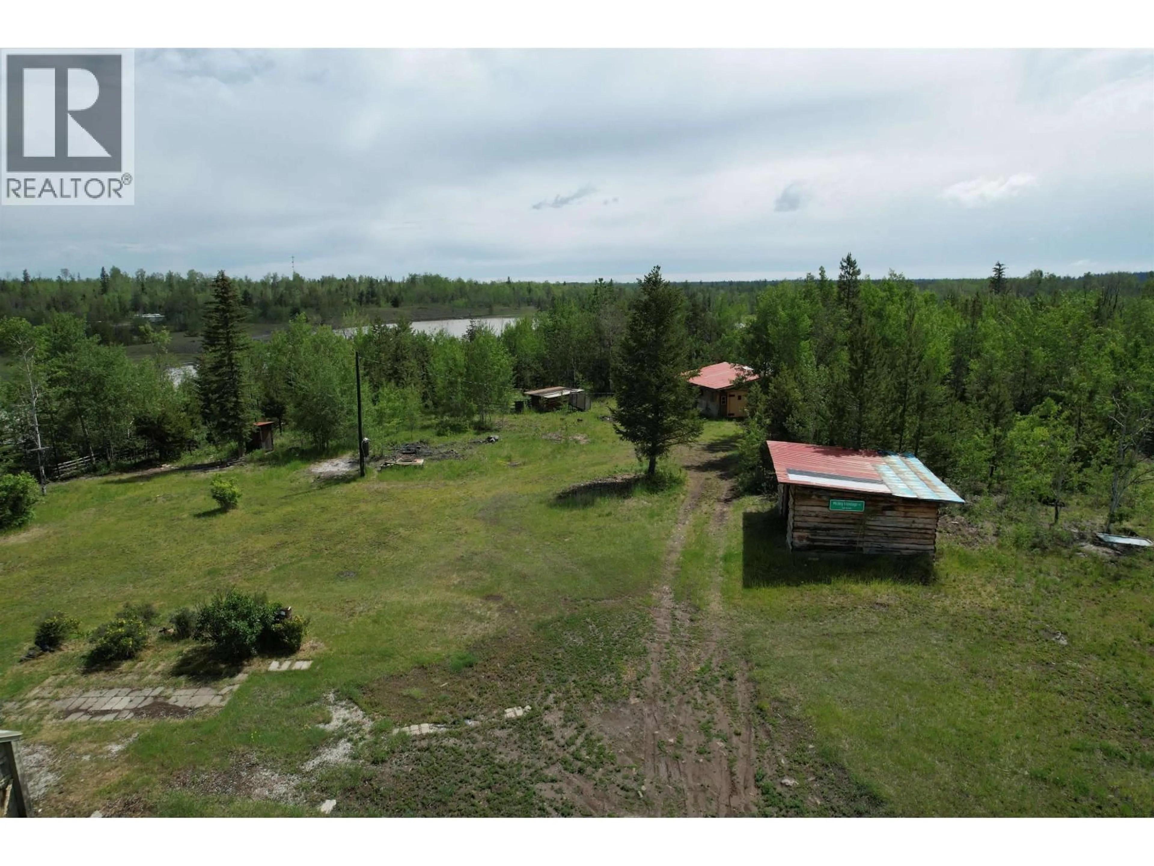 A pic from outside/outdoor area/front of a property/back of a property/a pic from drone, water/lake/river/ocean view for 1436 CARIBOO 97 HIGHWAY, 70 Mile House British Columbia V0K1K0