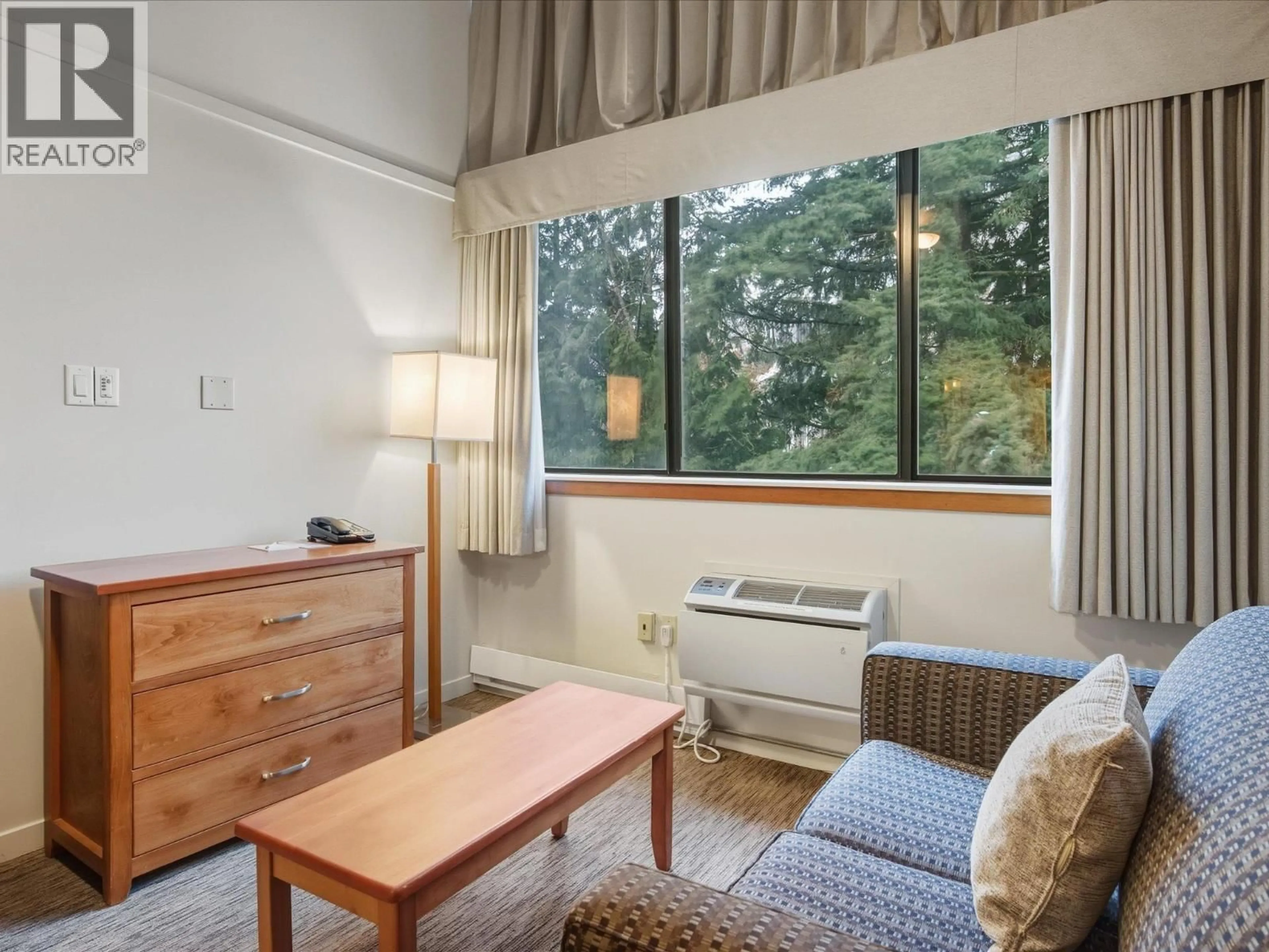 Living room with furniture, wood/laminate floor for 361 - 4429 SUNDIAL PLACE, Whistler British Columbia V8E1G8