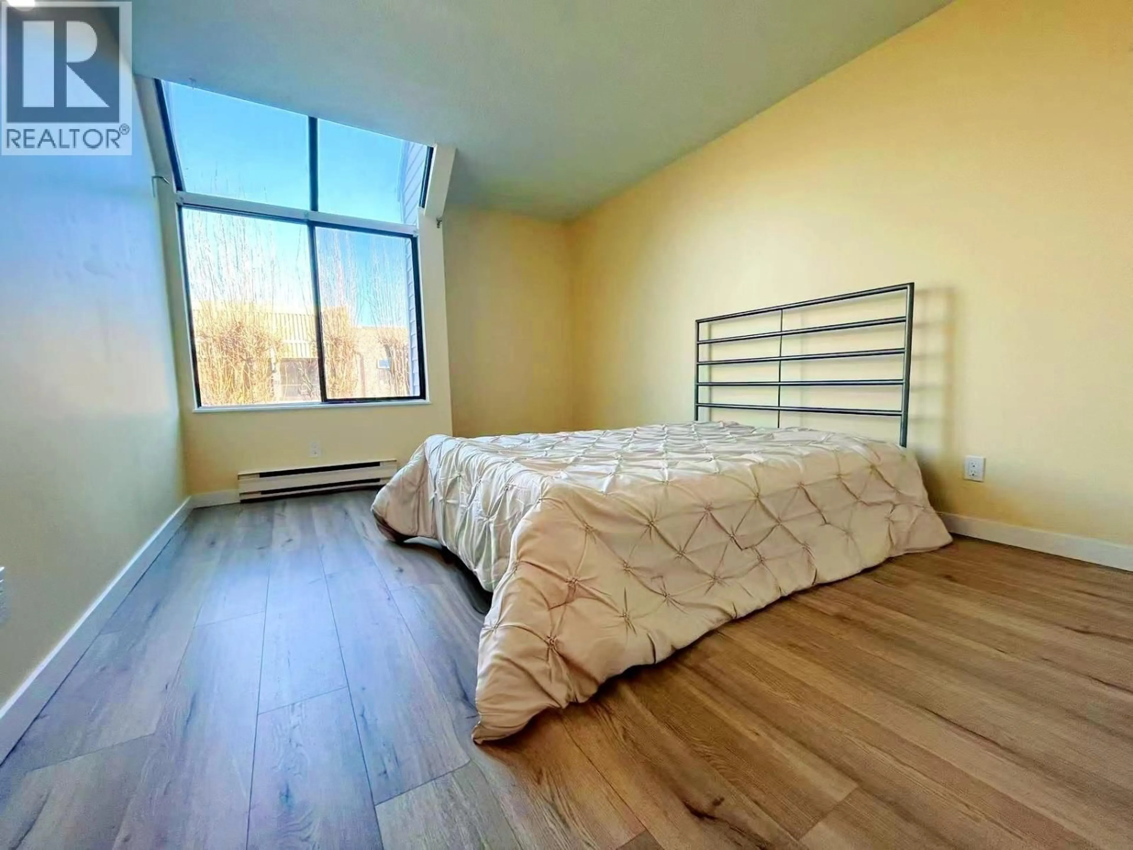 Bedroom with bed, wood/laminate floor for 307 - 5800 COONEY ROAD, Richmond British Columbia V6X3A8