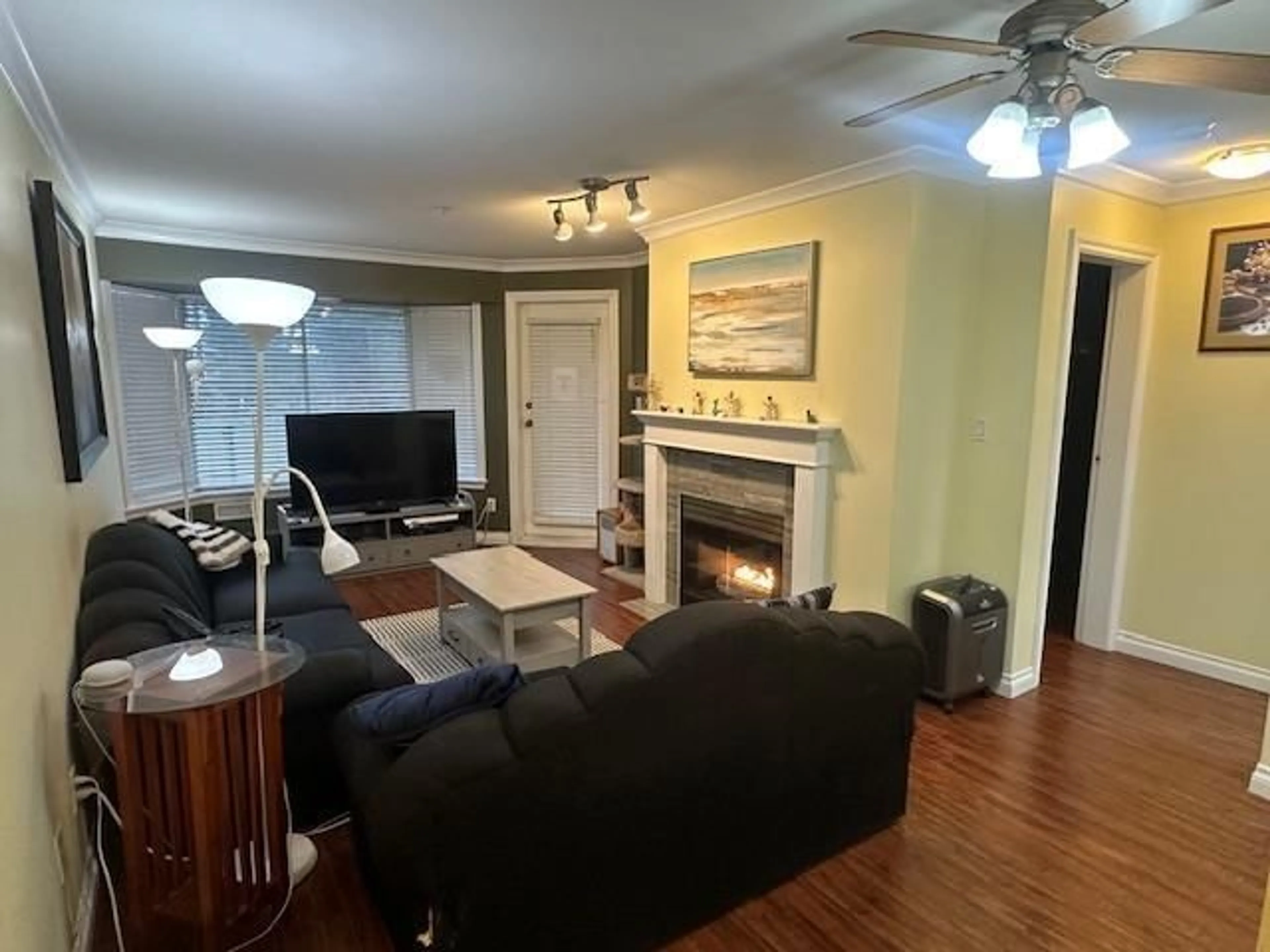 Living room with furniture, wood/laminate floor for 306 - 2964 TRETHEWEY STREET, Abbotsford British Columbia V2T6P4