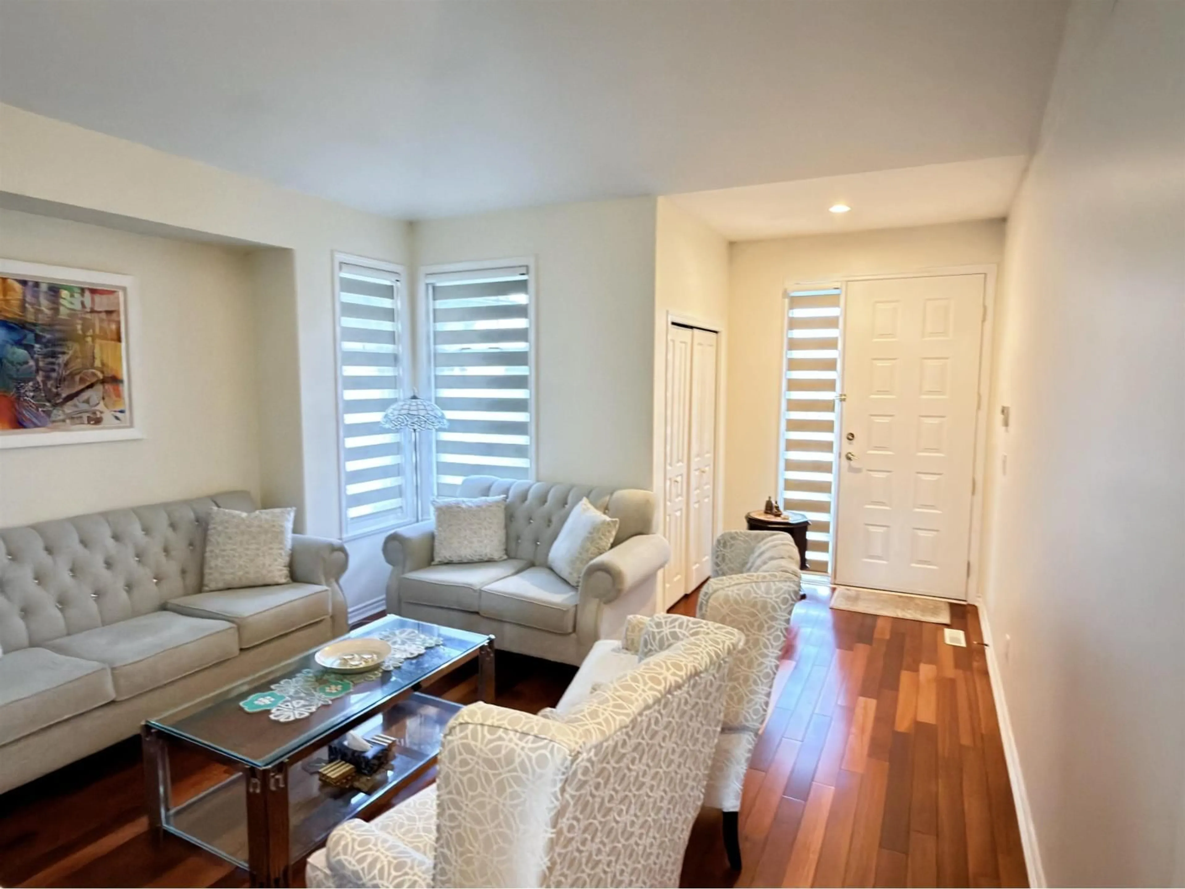 Living room with furniture, wood/laminate floor for 7450 147 STREET, Surrey British Columbia V3S8Y7