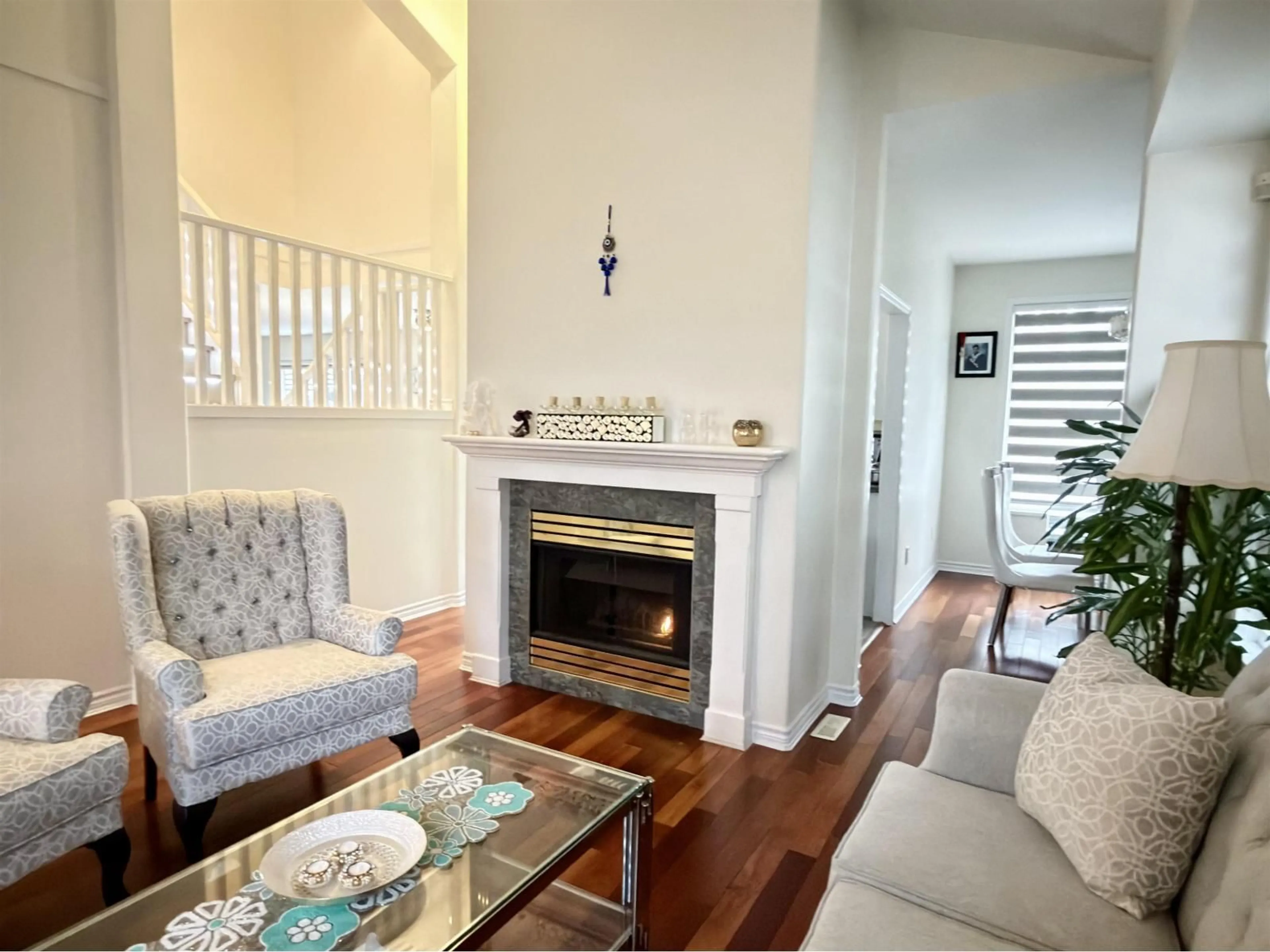 Living room with furniture, wood/laminate floor for 7450 147 STREET, Surrey British Columbia V3S8Y7