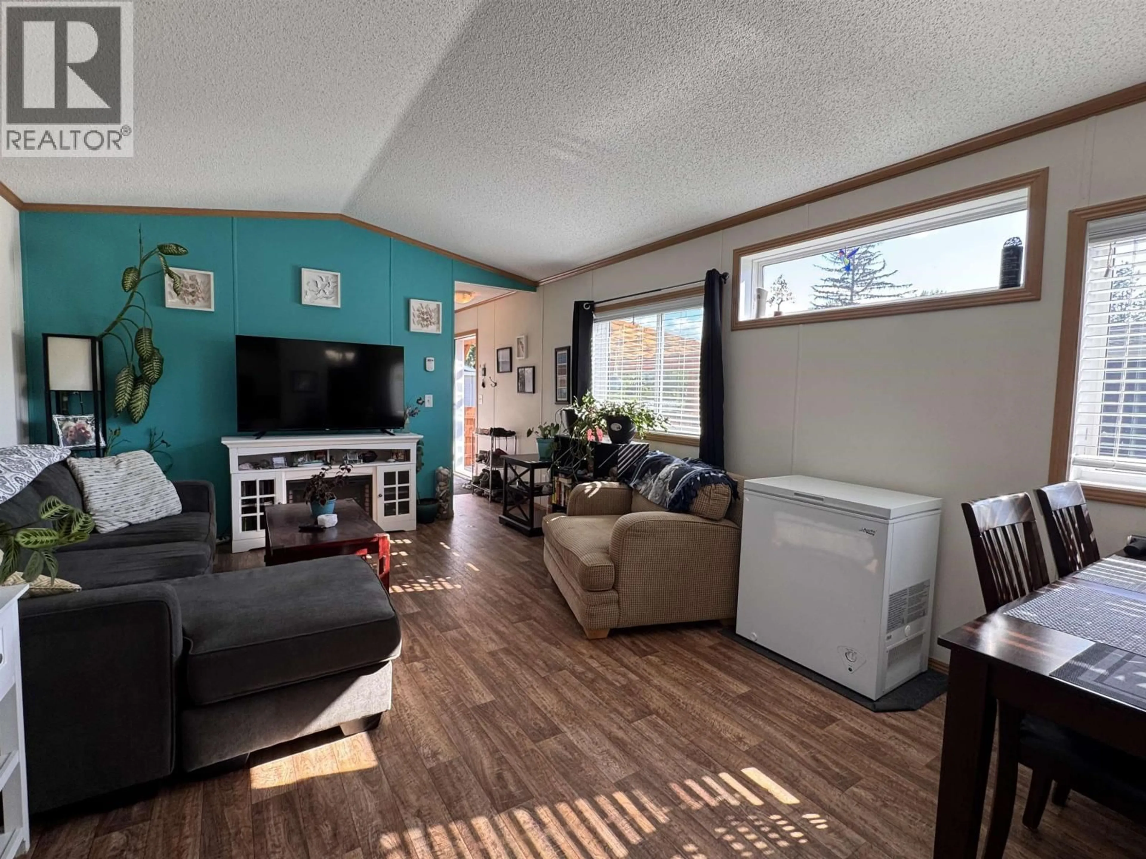 Living room with furniture, wood/laminate floor for 27 - 5204 ACKROYD STREET, Terrace British Columbia V8G1E6
