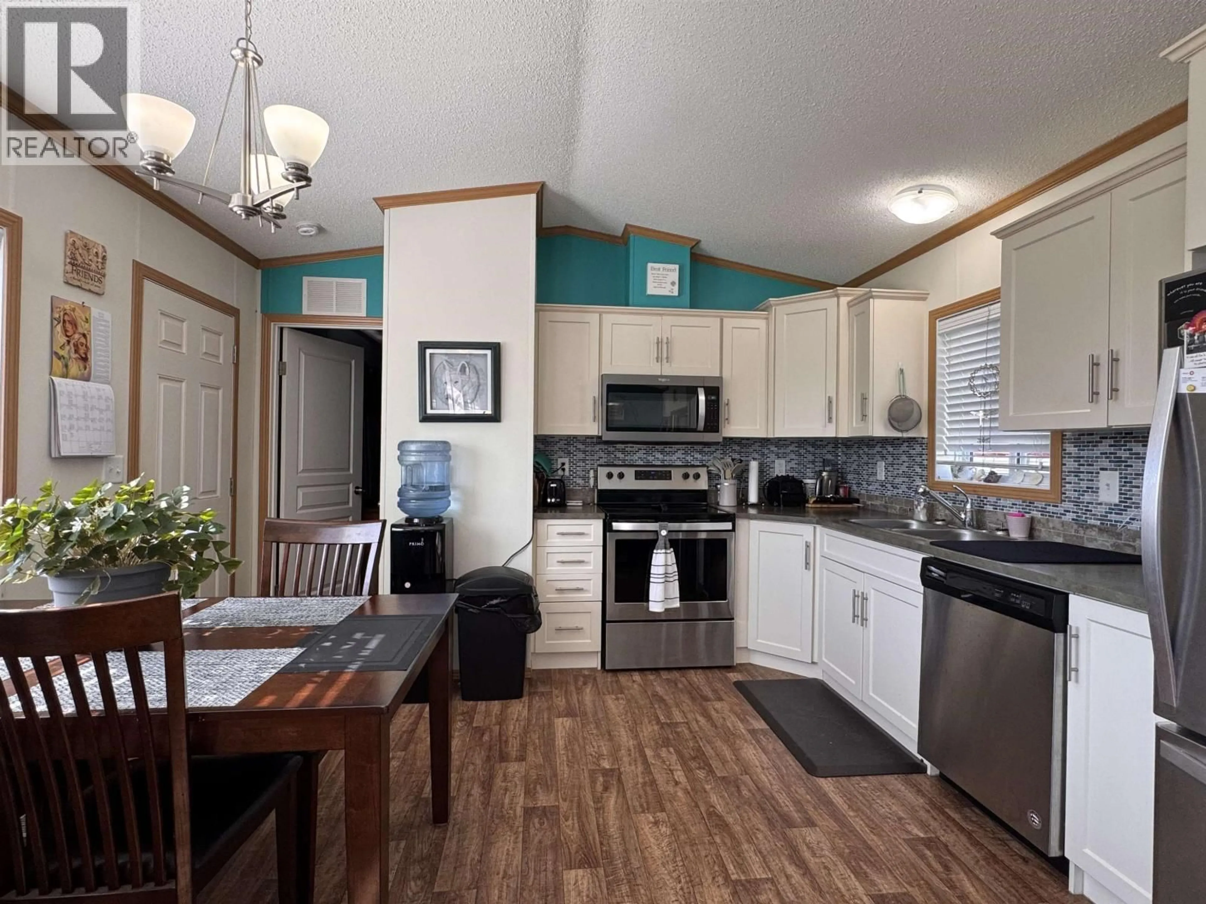 Open concept kitchen, wood/laminate floor for 27 - 5204 ACKROYD STREET, Terrace British Columbia V8G1E6