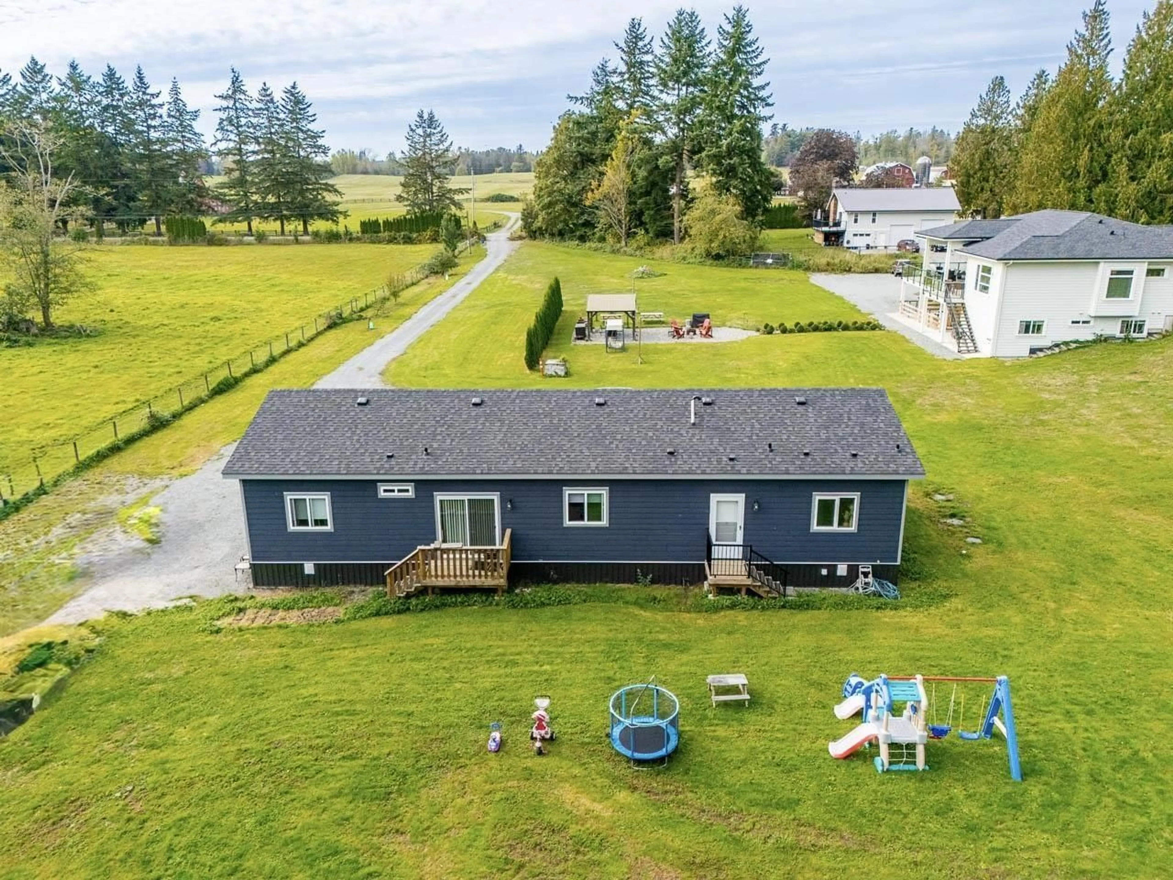 A pic from outside/outdoor area/front of a property/back of a property/a pic from drone, water/lake/river/ocean view for 934 248 STREET, Langley British Columbia V4W2G1
