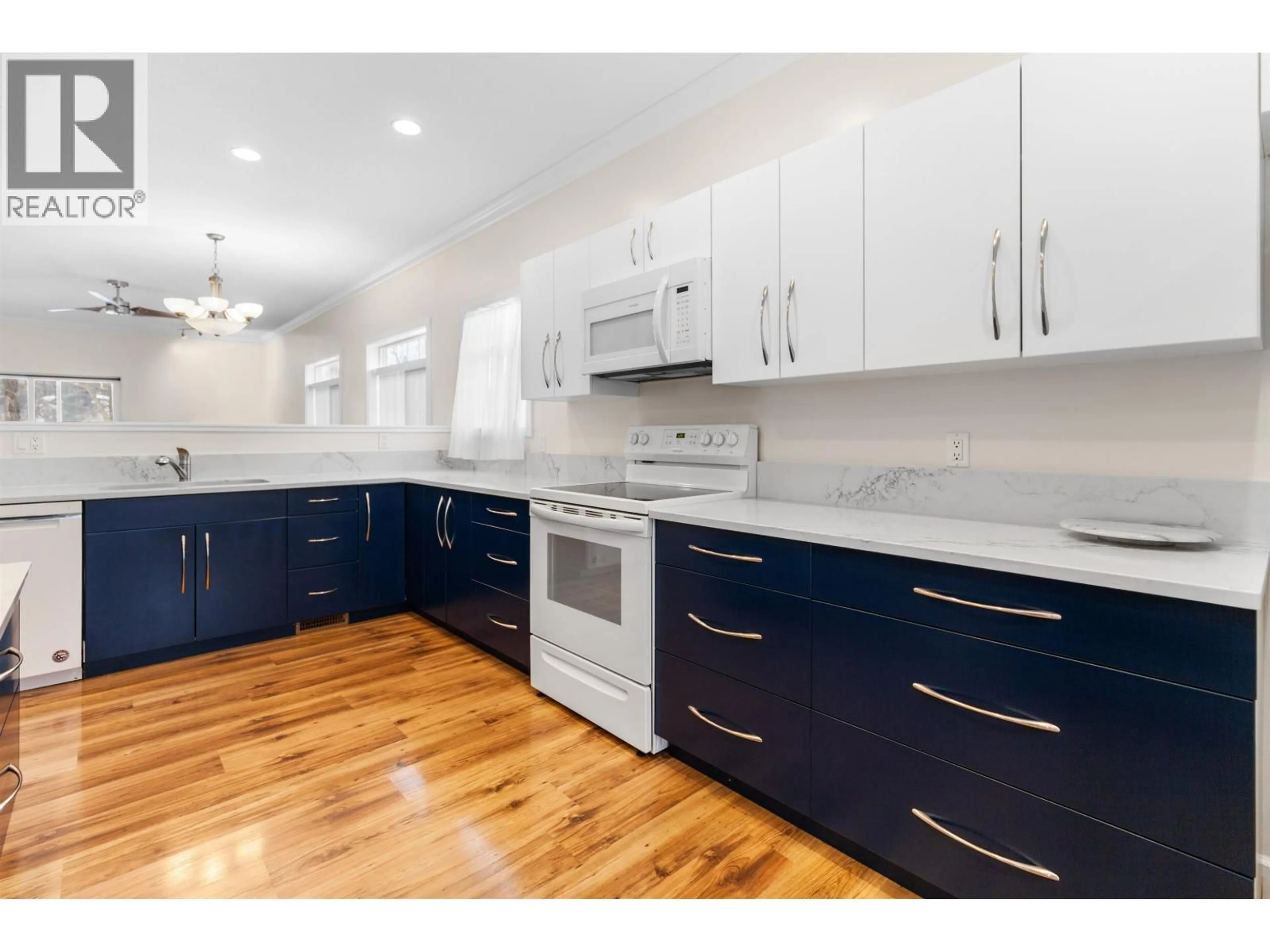 Open concept kitchen, wood/laminate floor for 132 - 1702 DYKE ROAD, Quesnel British Columbia V2J6A4