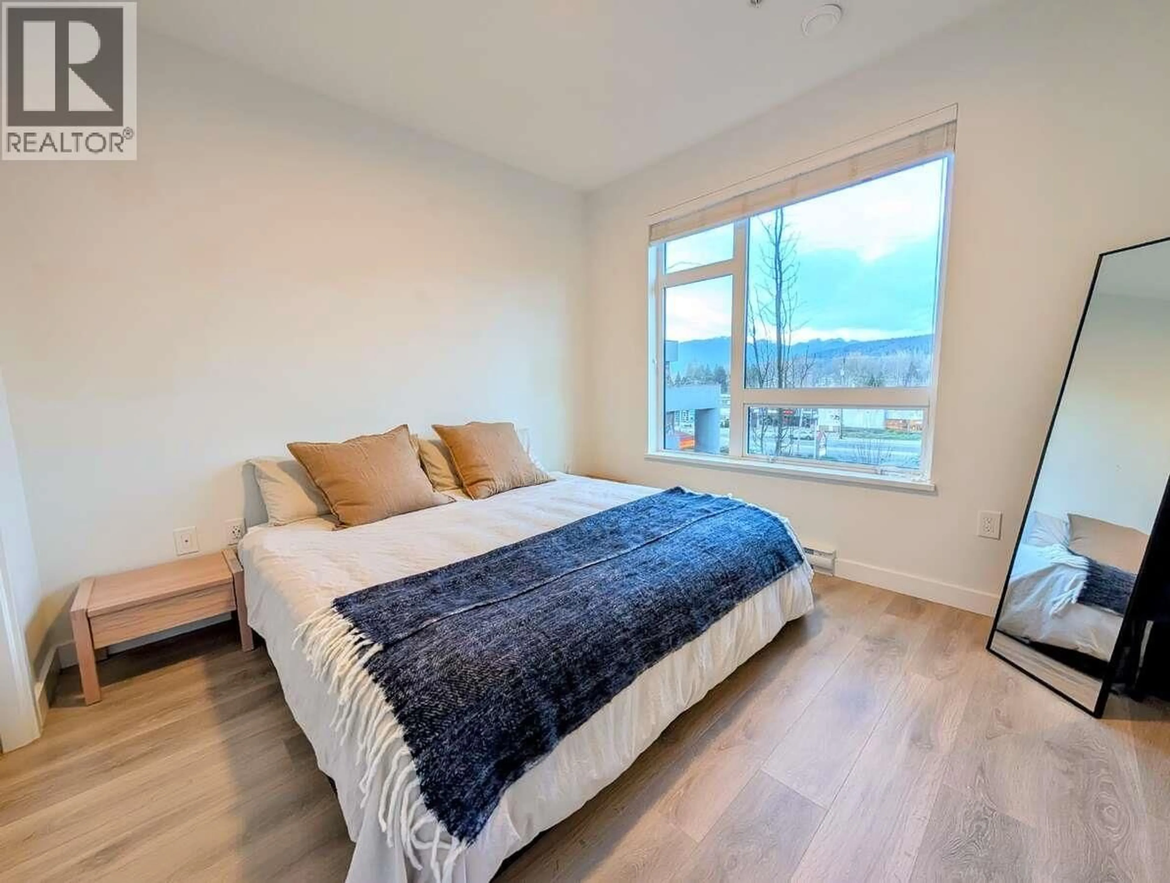 Bedroom with bed, wood/laminate floor for 316 - 3038 ST GEORGE STREET, Port Moody British Columbia V3H0L3