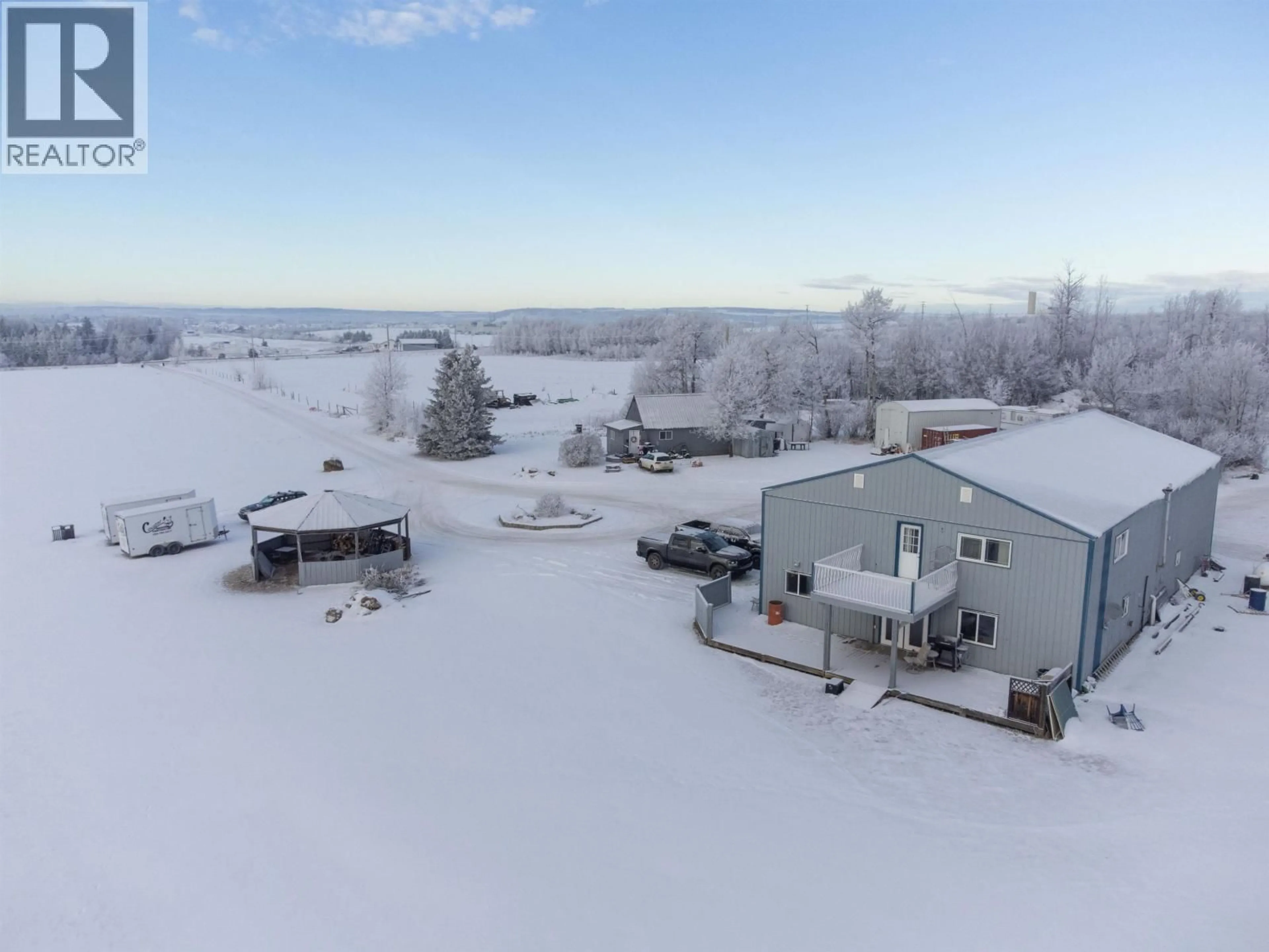 A pic from outside/outdoor area/front of a property/back of a property/a pic from drone, water/lake/river/ocean view for 10727 NORTHERN LIGHTS DRIVE, Fort St. John British Columbia V1J0S8