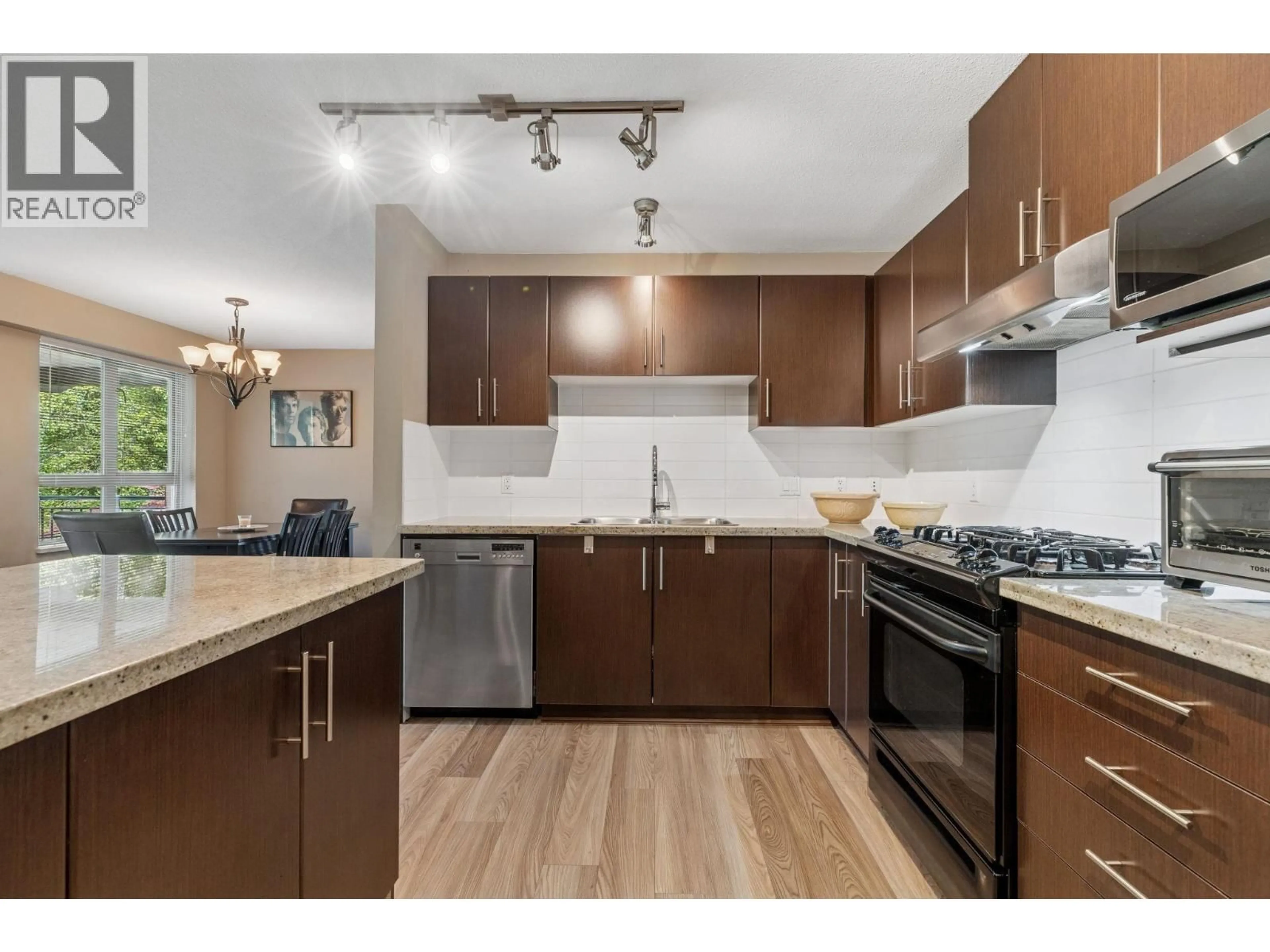Open concept kitchen, wood/laminate floor for 212 - 600 KLAHANIE DRIVE, Port Moody British Columbia V3H5L2