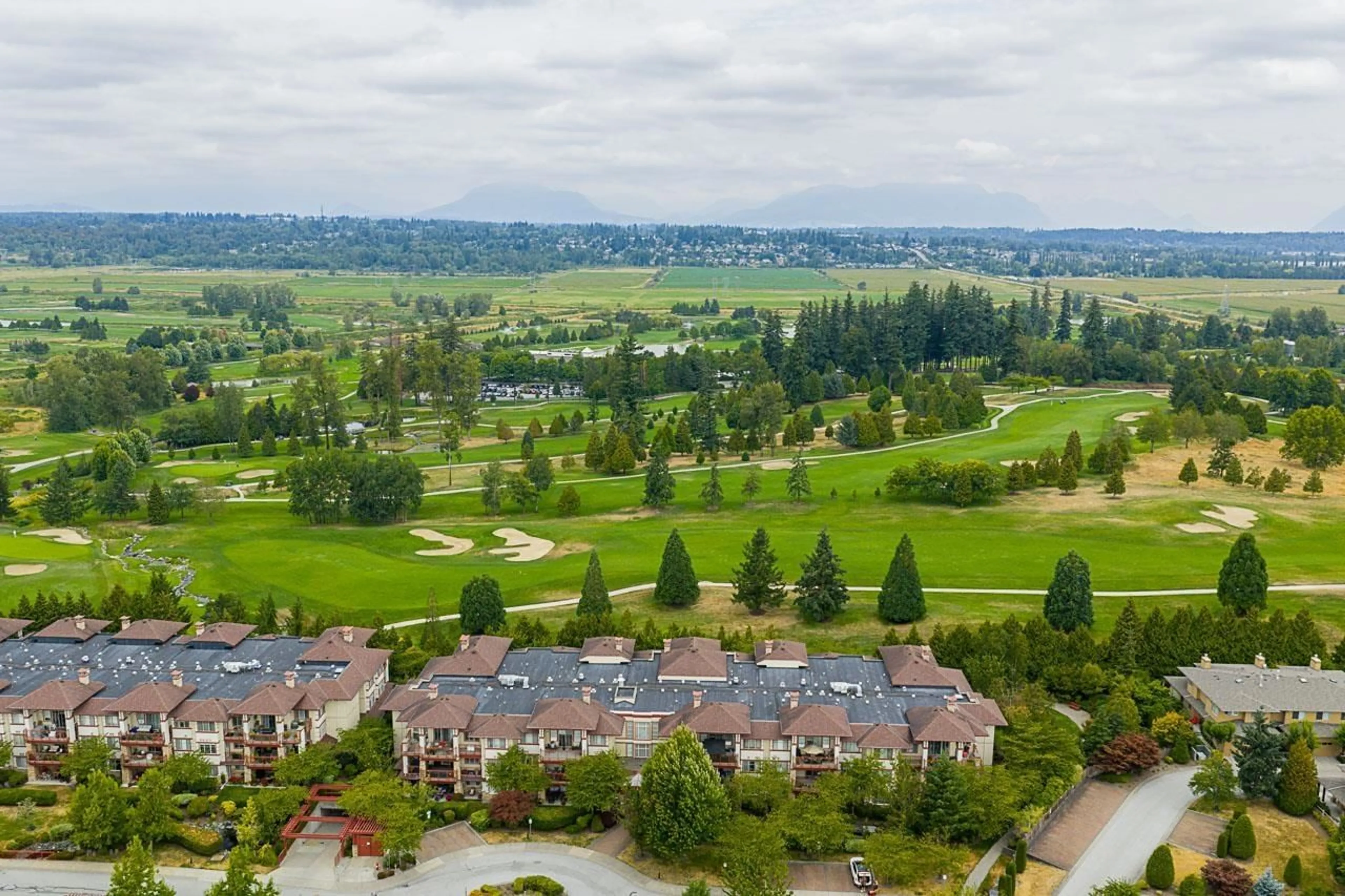 A pic from outside/outdoor area/front of a property/back of a property/a pic from drone, mountain view for 308 - 16499 64 AVENUE, Surrey British Columbia V3S6V7