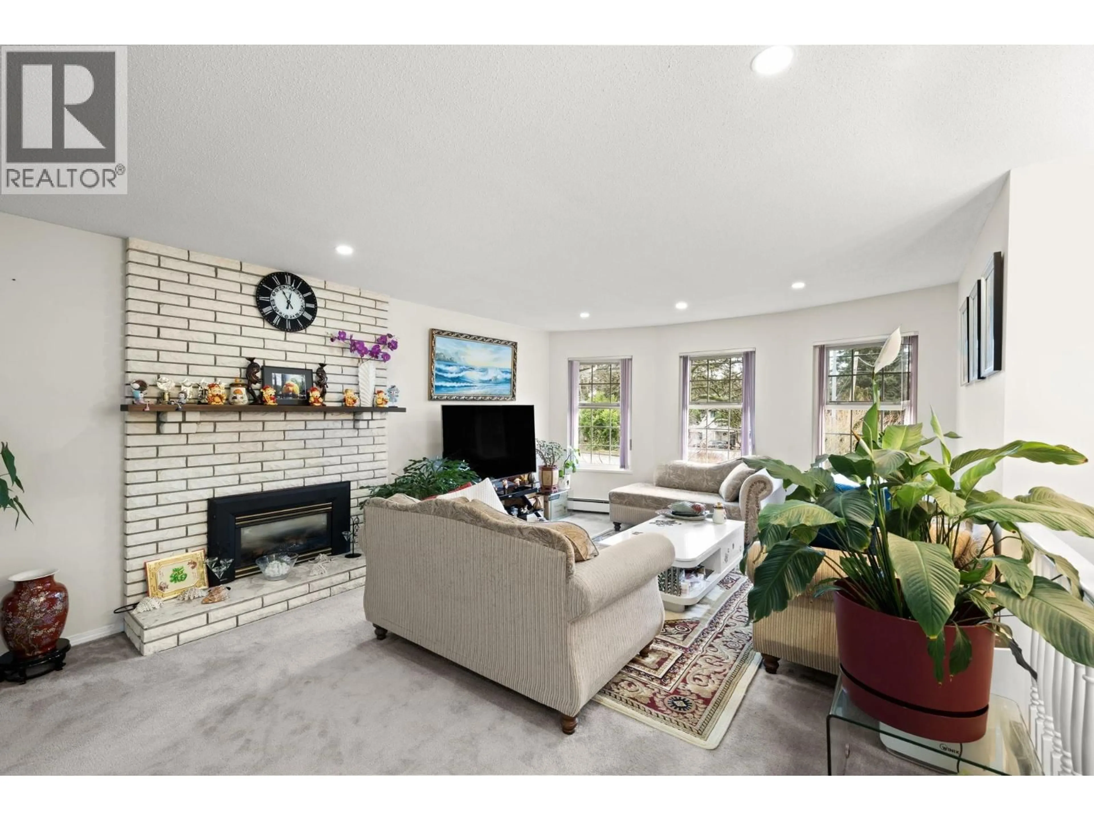 Living room with furniture, ceramic/tile floor for 7451 NO. 2 ROAD, Richmond British Columbia V7C3L7
