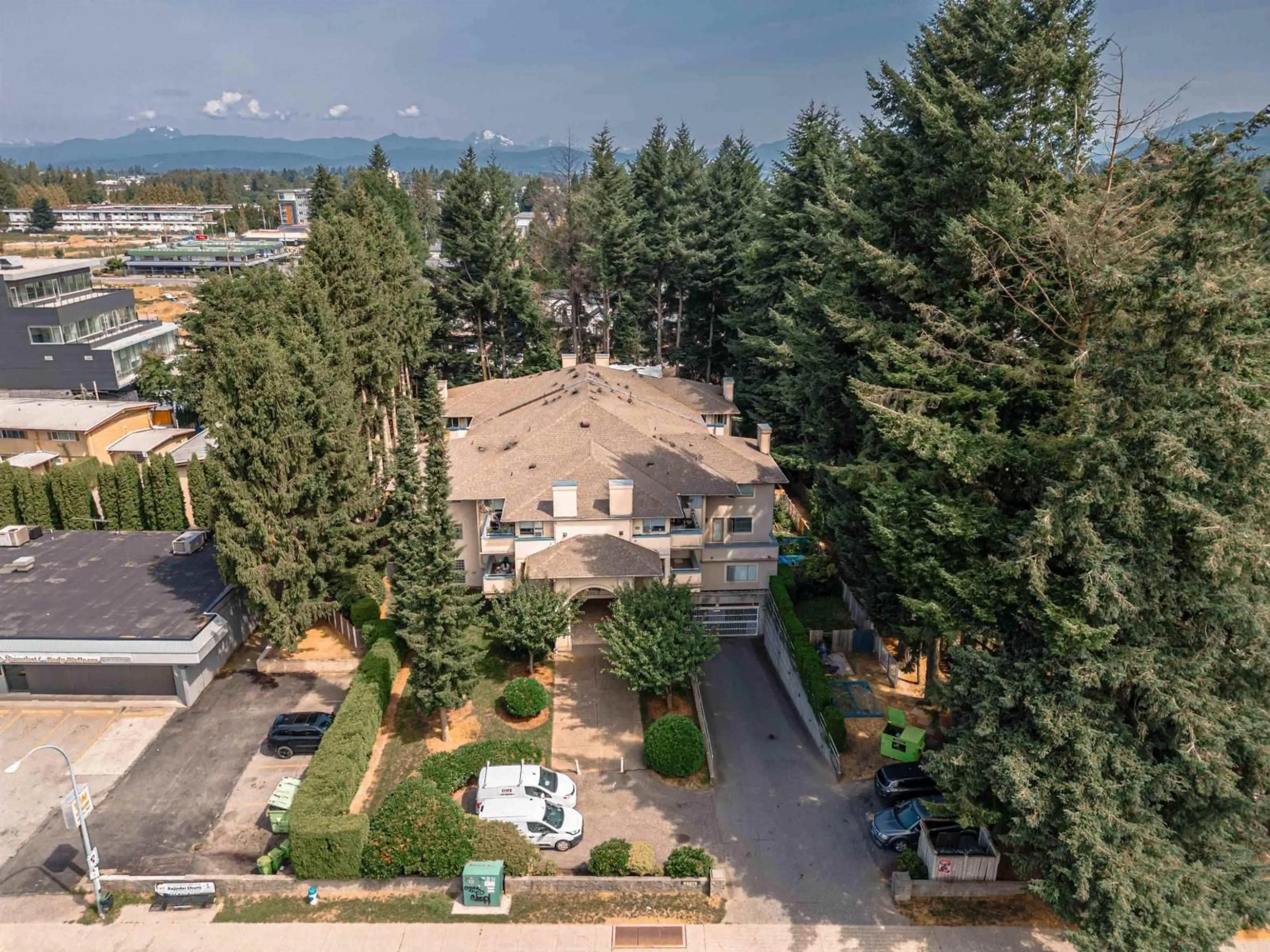 A pic from outside/outdoor area/front of a property/back of a property/a pic from drone, mountain view for 102 - 33675 MARSHALL ROAD, Abbotsford British Columbia V2S1L4