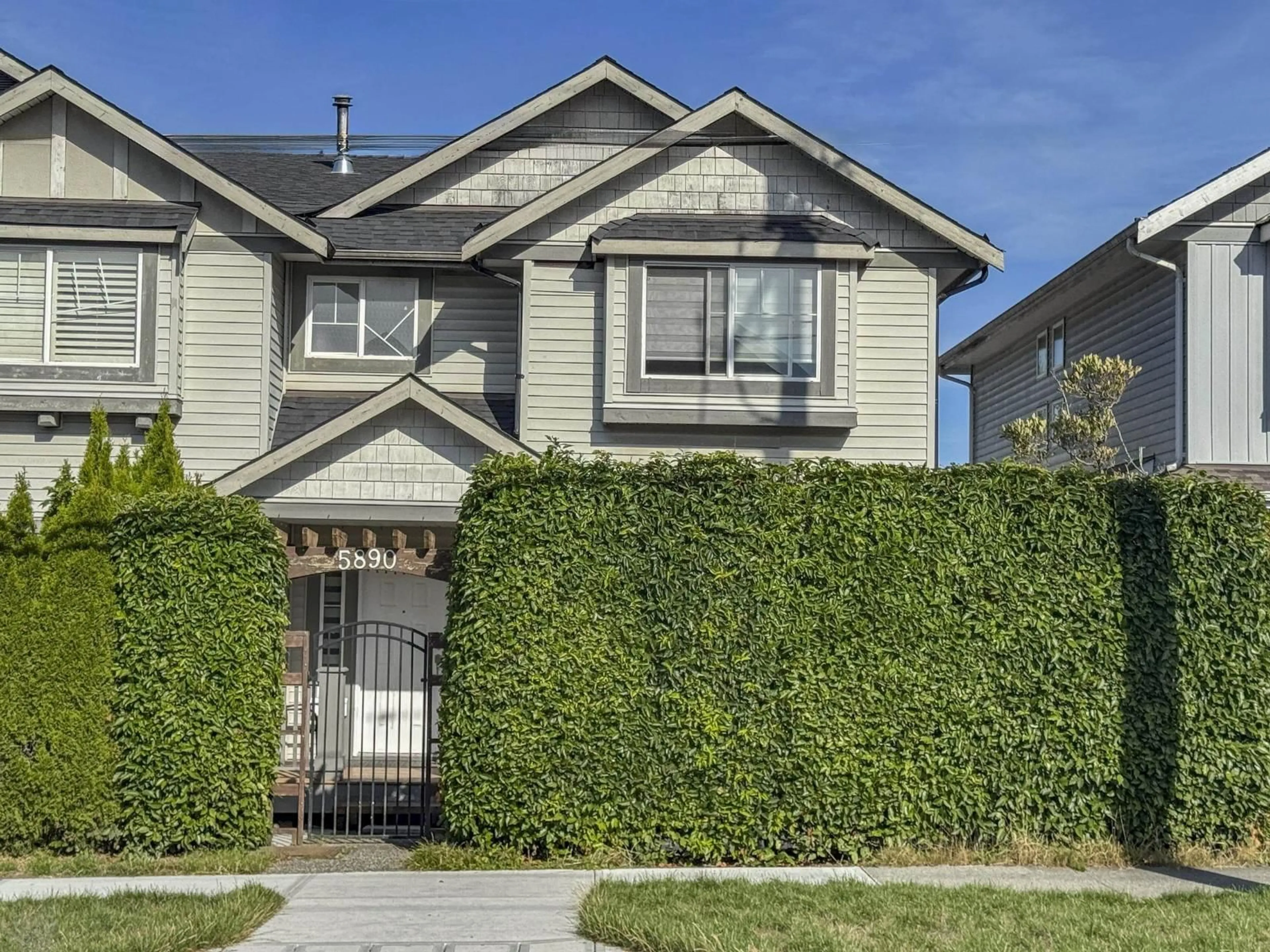 Home with vinyl exterior material, street for 5890 148 STREET, Surrey British Columbia V3S3B8