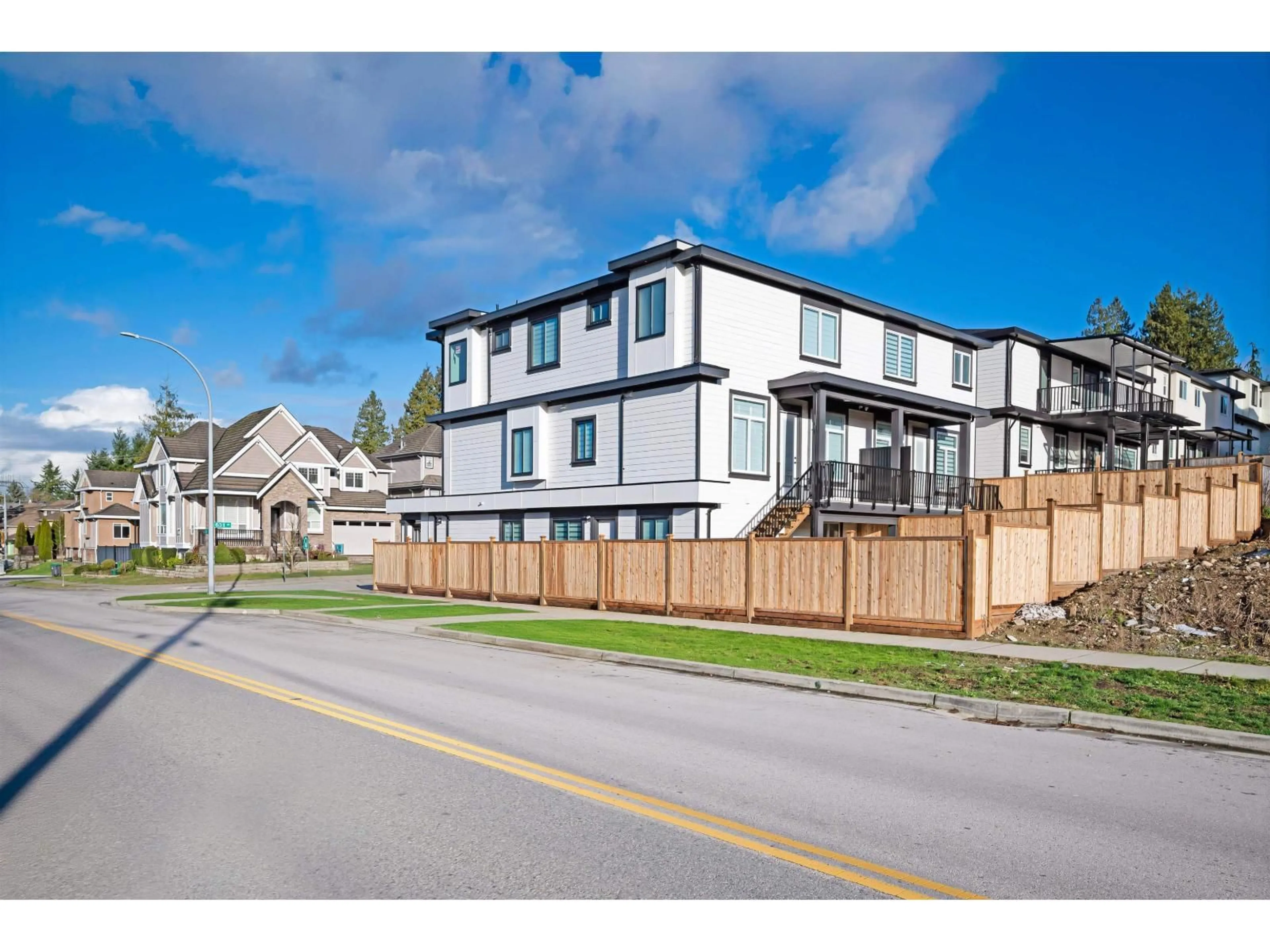 A pic from outside/outdoor area/front of a property/back of a property/a pic from drone, street for 102 - 18002 63B AVENUE, Surrey British Columbia V3S4G1