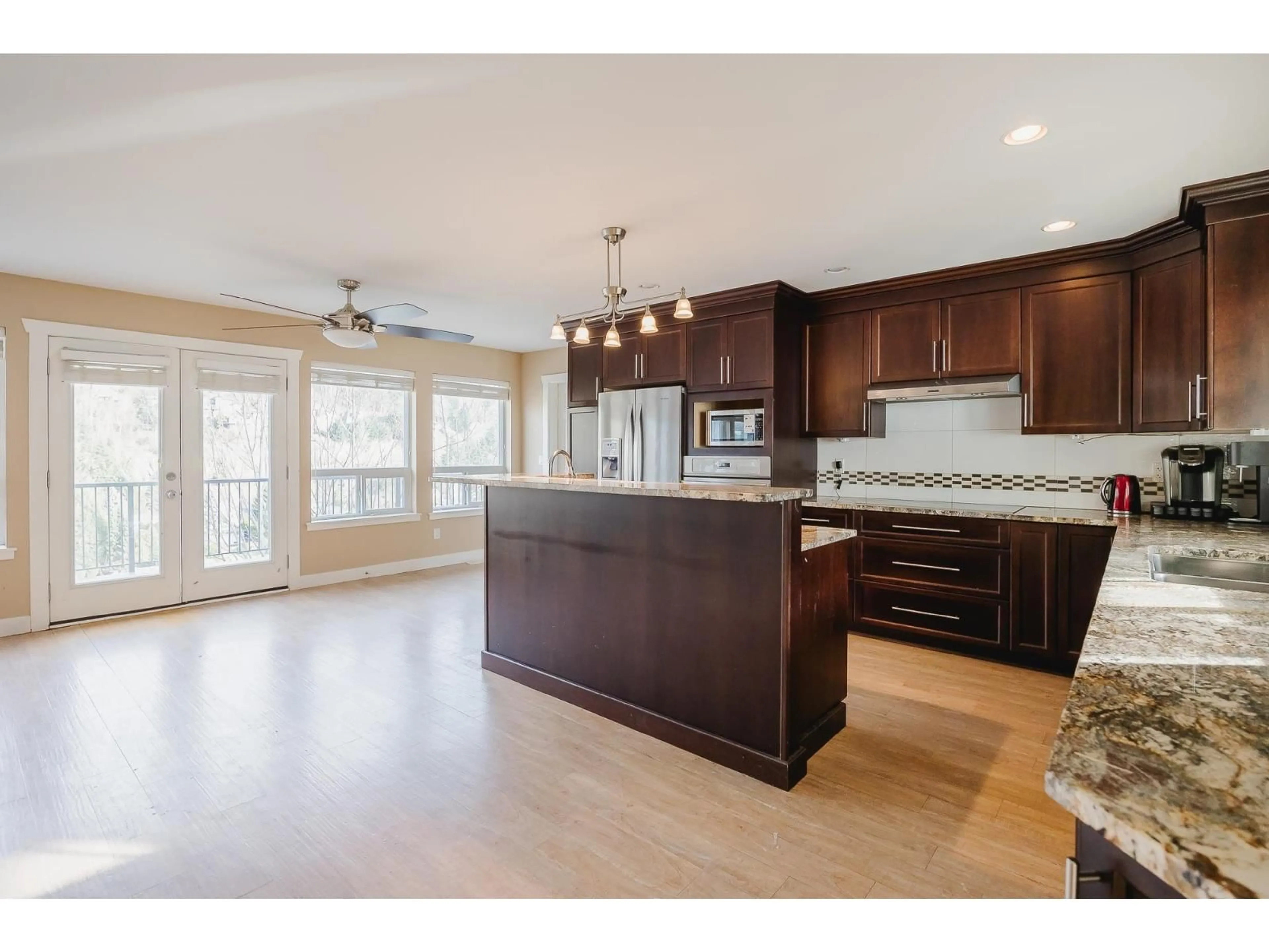 Open concept kitchen, wood/laminate floor for 2284 ORCHARD DRIVE, Abbotsford British Columbia V3G2B7