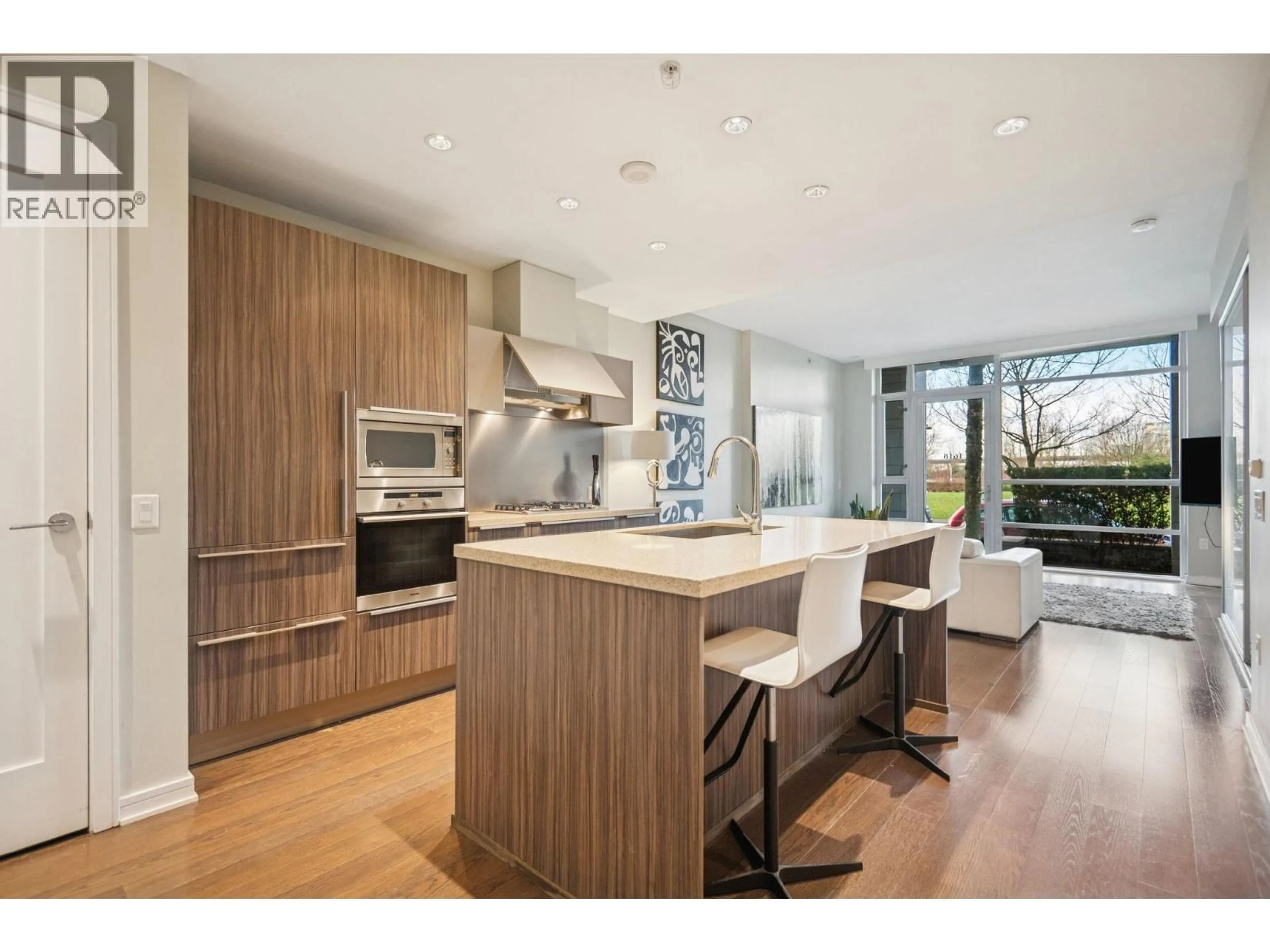 Open concept kitchen, wood/laminate floor for 1618 COLUMBIA STREET, Vancouver British Columbia V5Y0B6