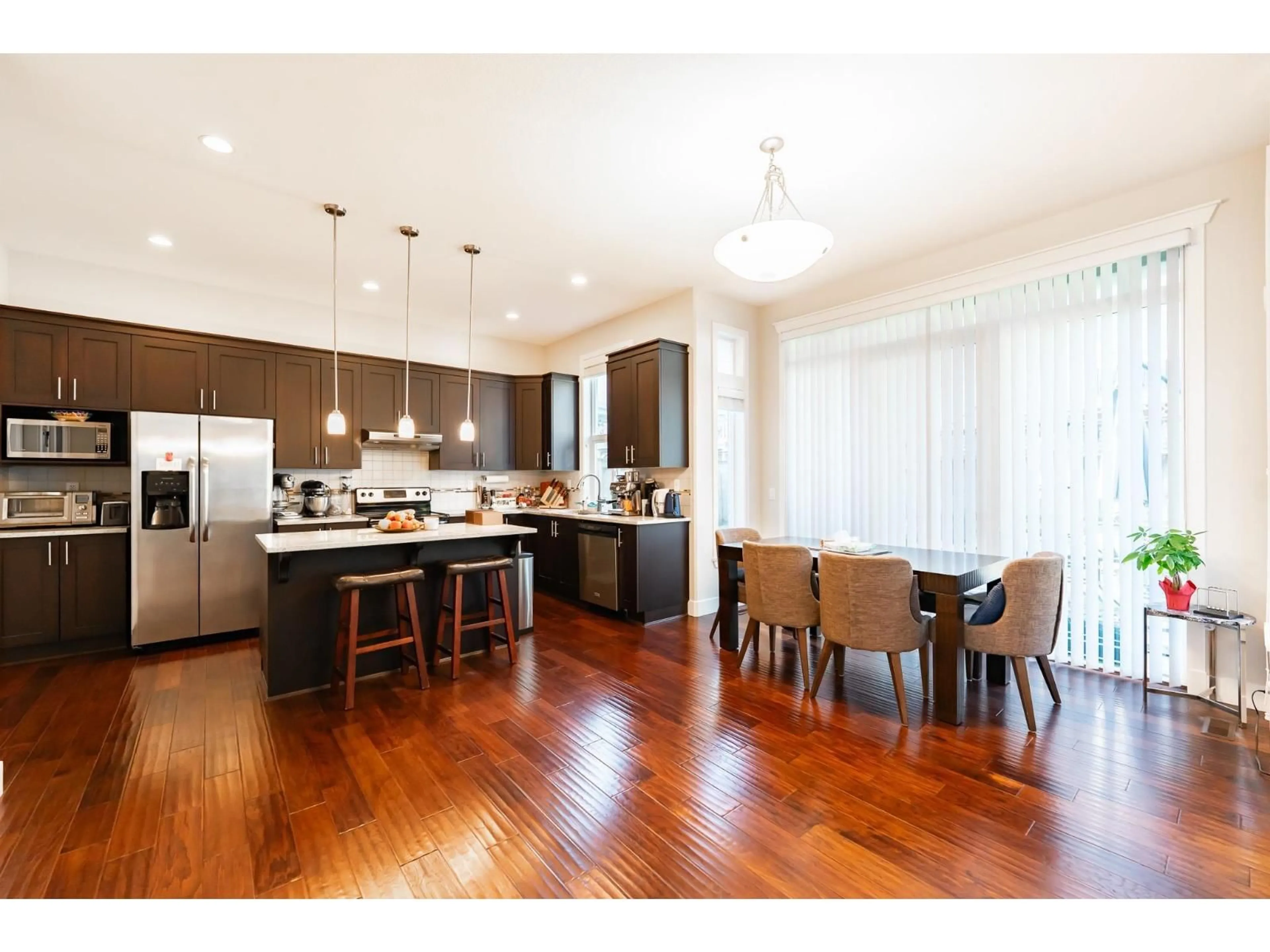 Open concept kitchen, wood/laminate floor for 16919 79 AVENUE, Surrey British Columbia V4N6L4