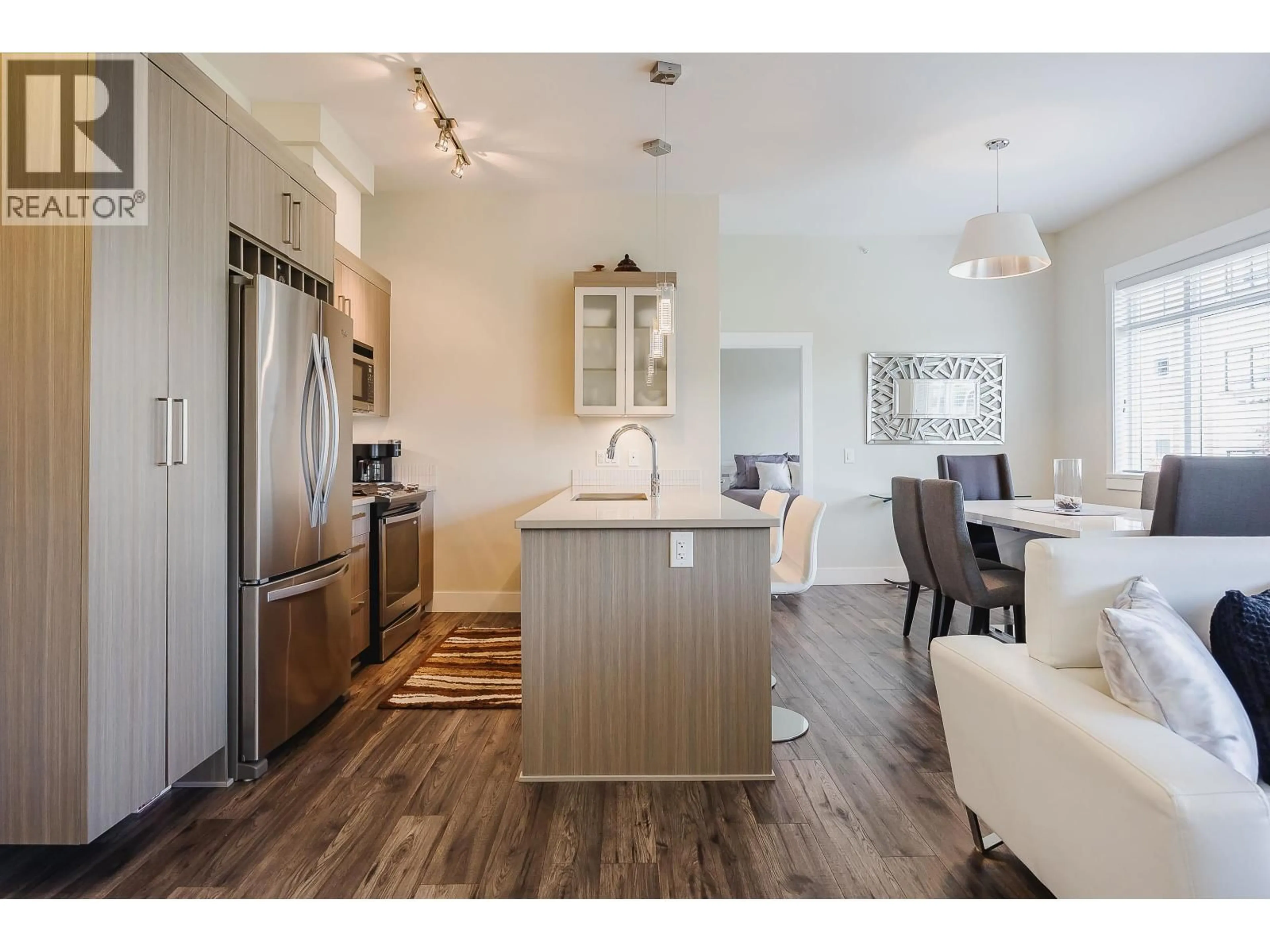 Open concept kitchen, wood/laminate floor for 409 - 22327 RIVER ROAD, Maple Ridge British Columbia V2X2C7