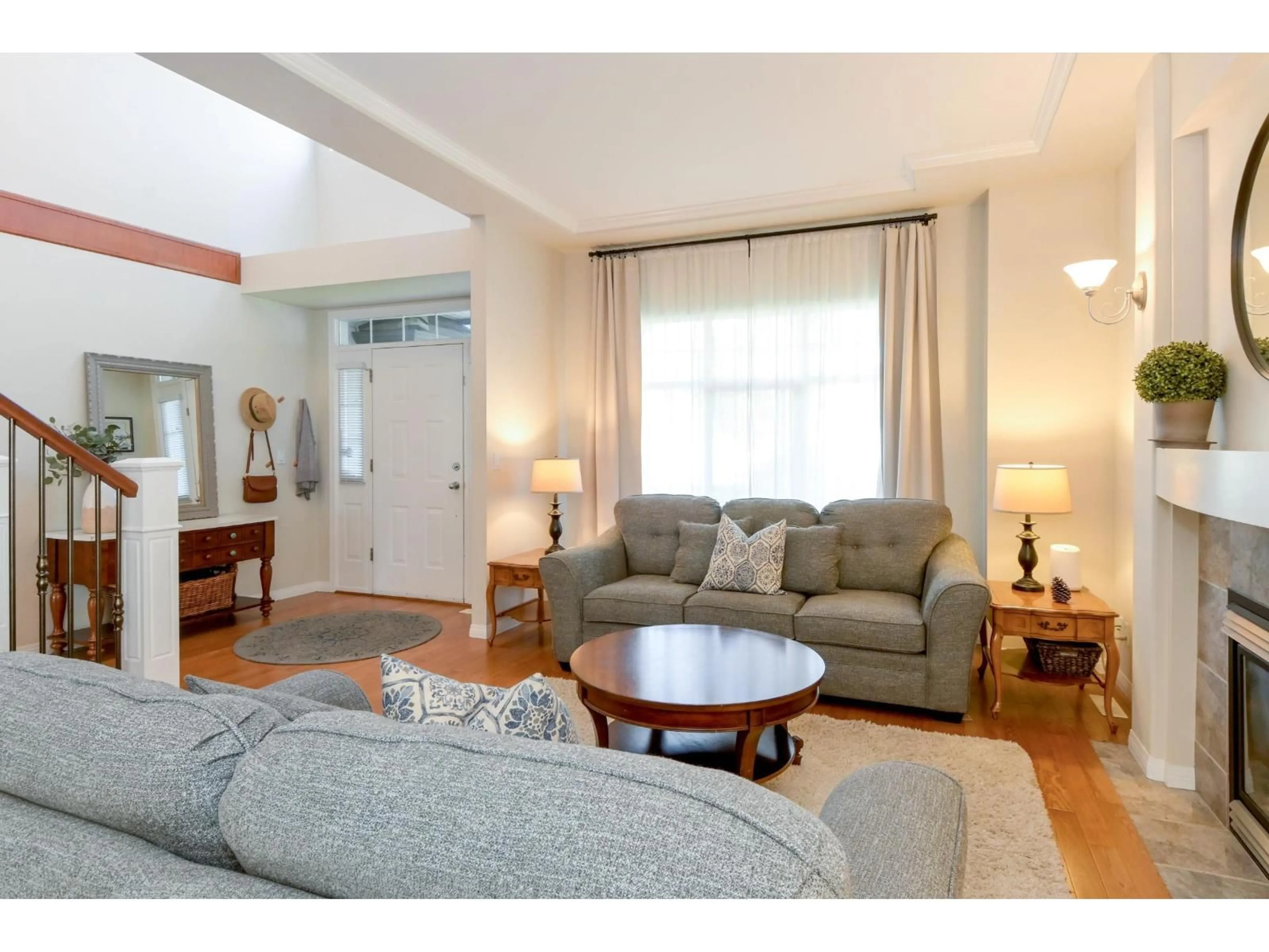 Living room with furniture, wood/laminate floor for 18290 CLAYTONWOOD CRESCENT, Surrey British Columbia V3S0M3