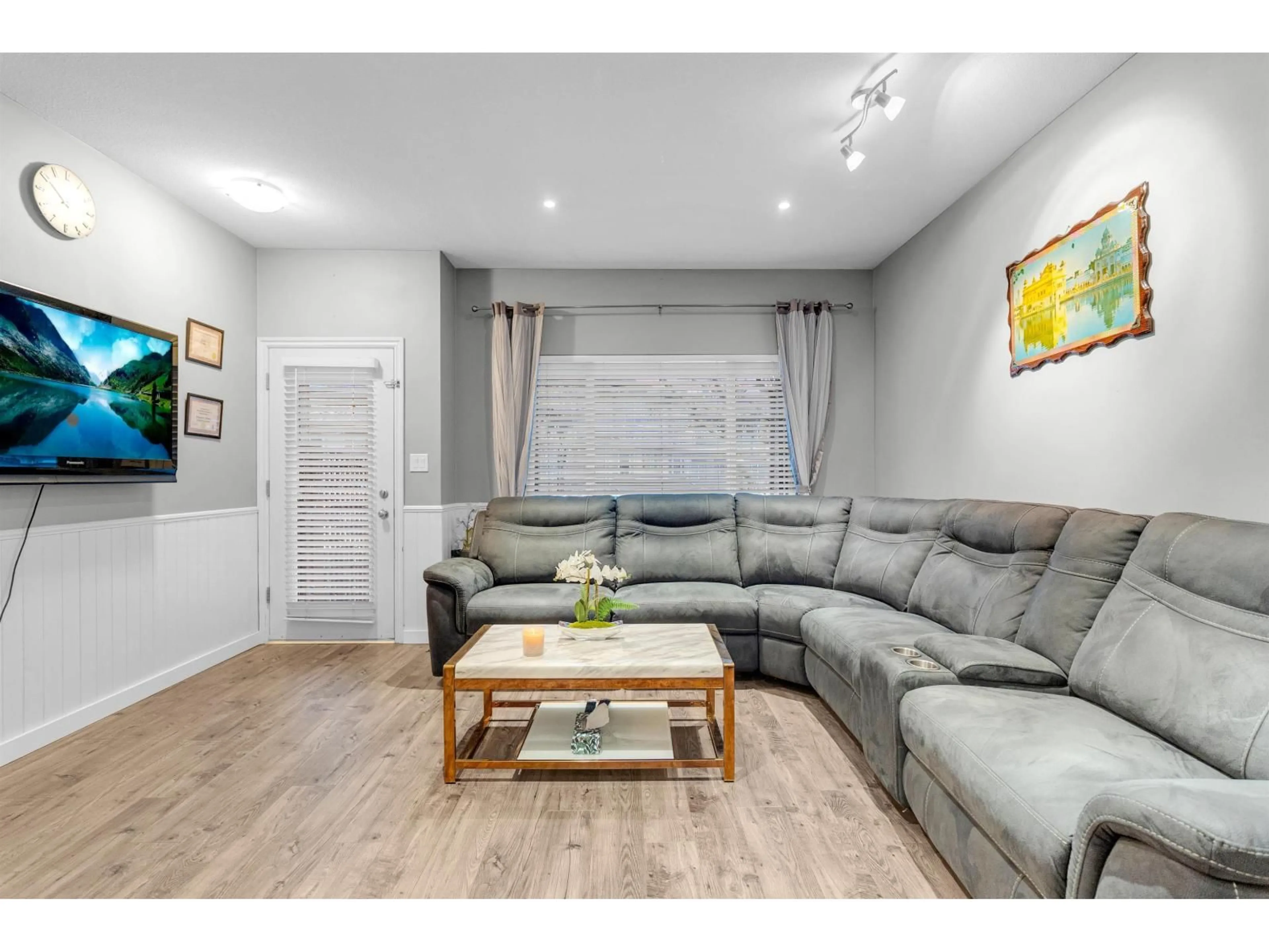 Living room with furniture, wood/laminate floor for 49 - 18701 66 AVENUE, Surrey British Columbia V3S4P3