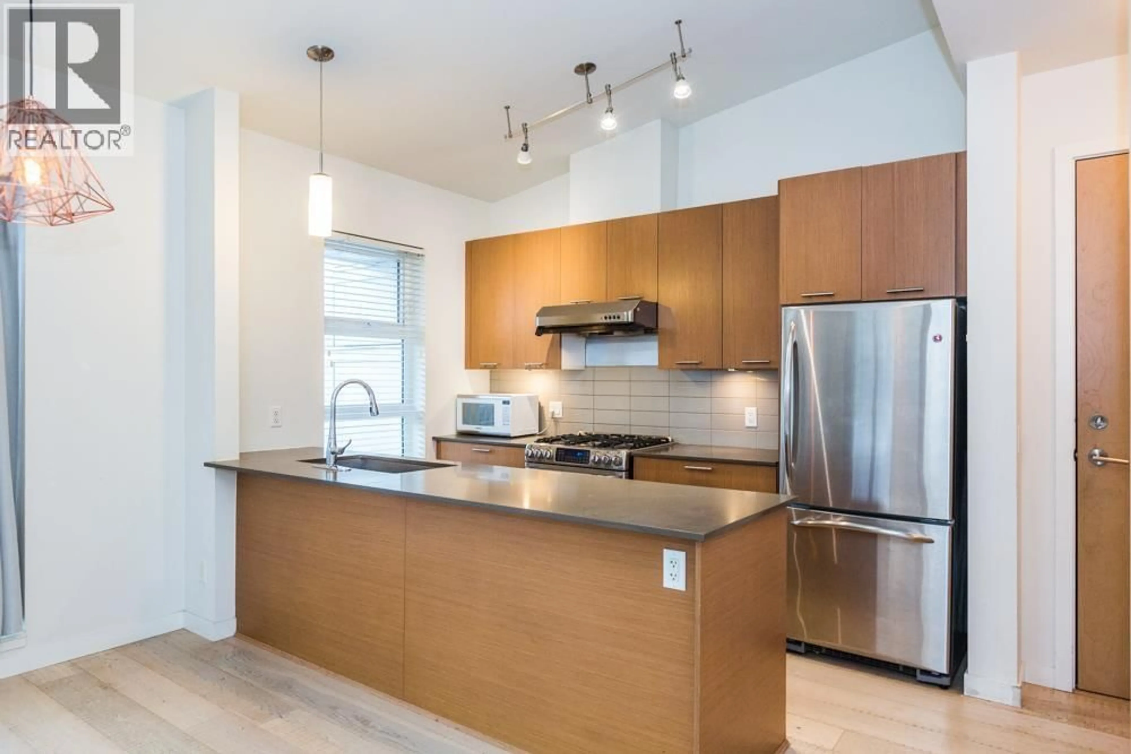 Open concept kitchen, unknown for 305 - 215 BROOKES STREET, New Westminster British Columbia V3M0G5