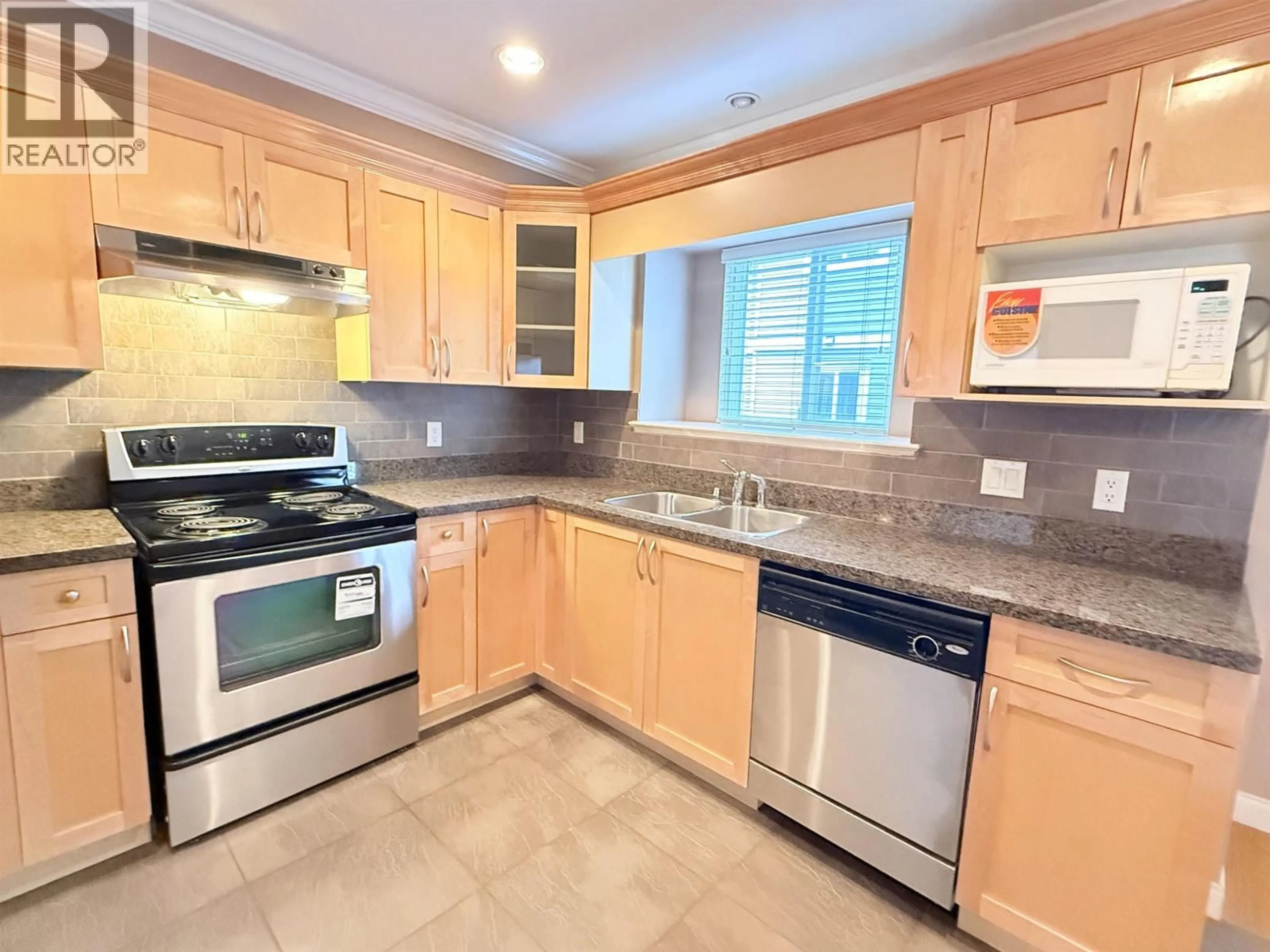 Standard kitchen, ceramic/tile floor for 102 - 3760 DOMINION STREET, Burnaby British Columbia V5G1B9