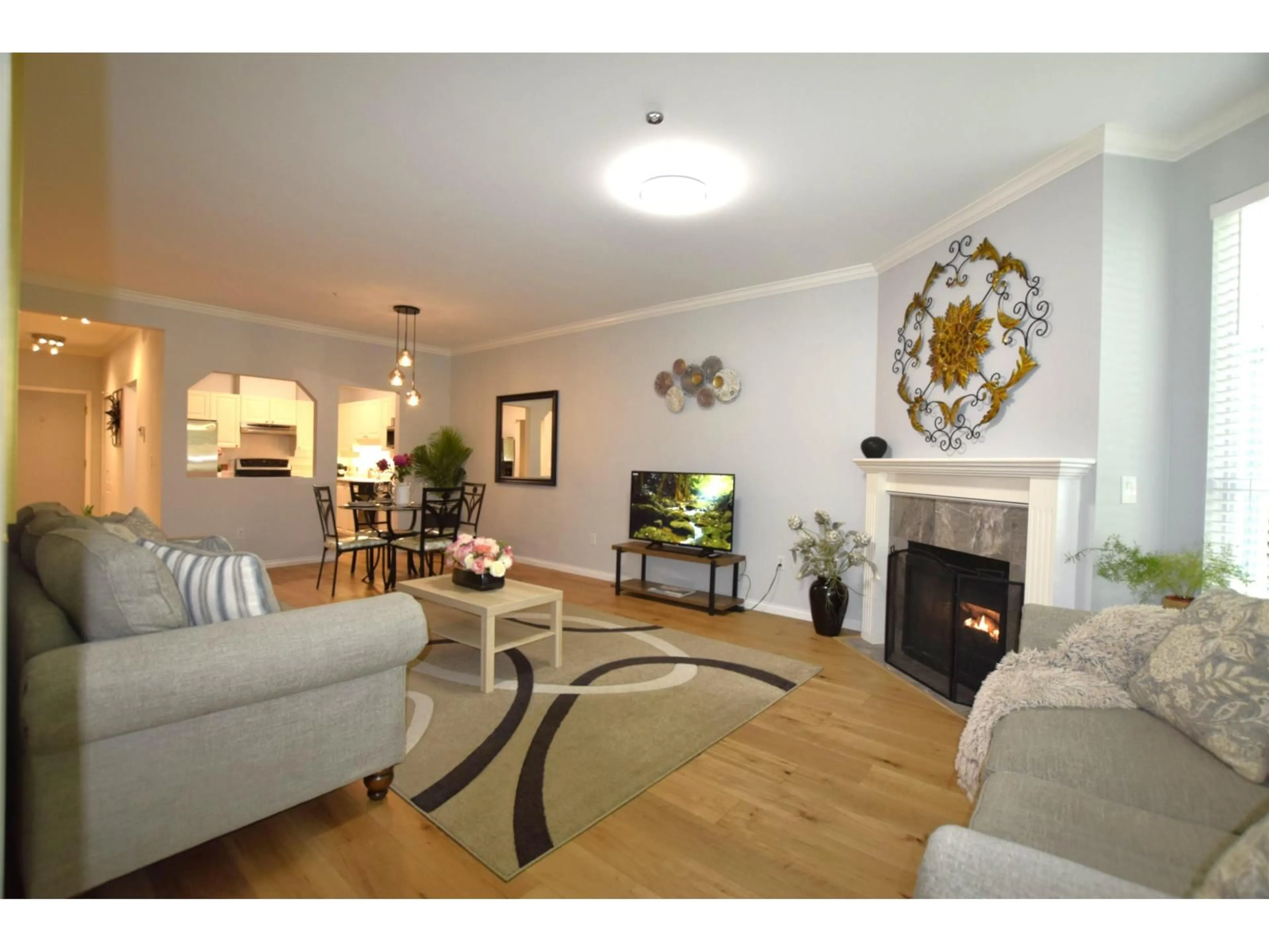 Living room with furniture, wood/laminate floor for 304 - 5646 200 STREET, Langley British Columbia V3A1M8