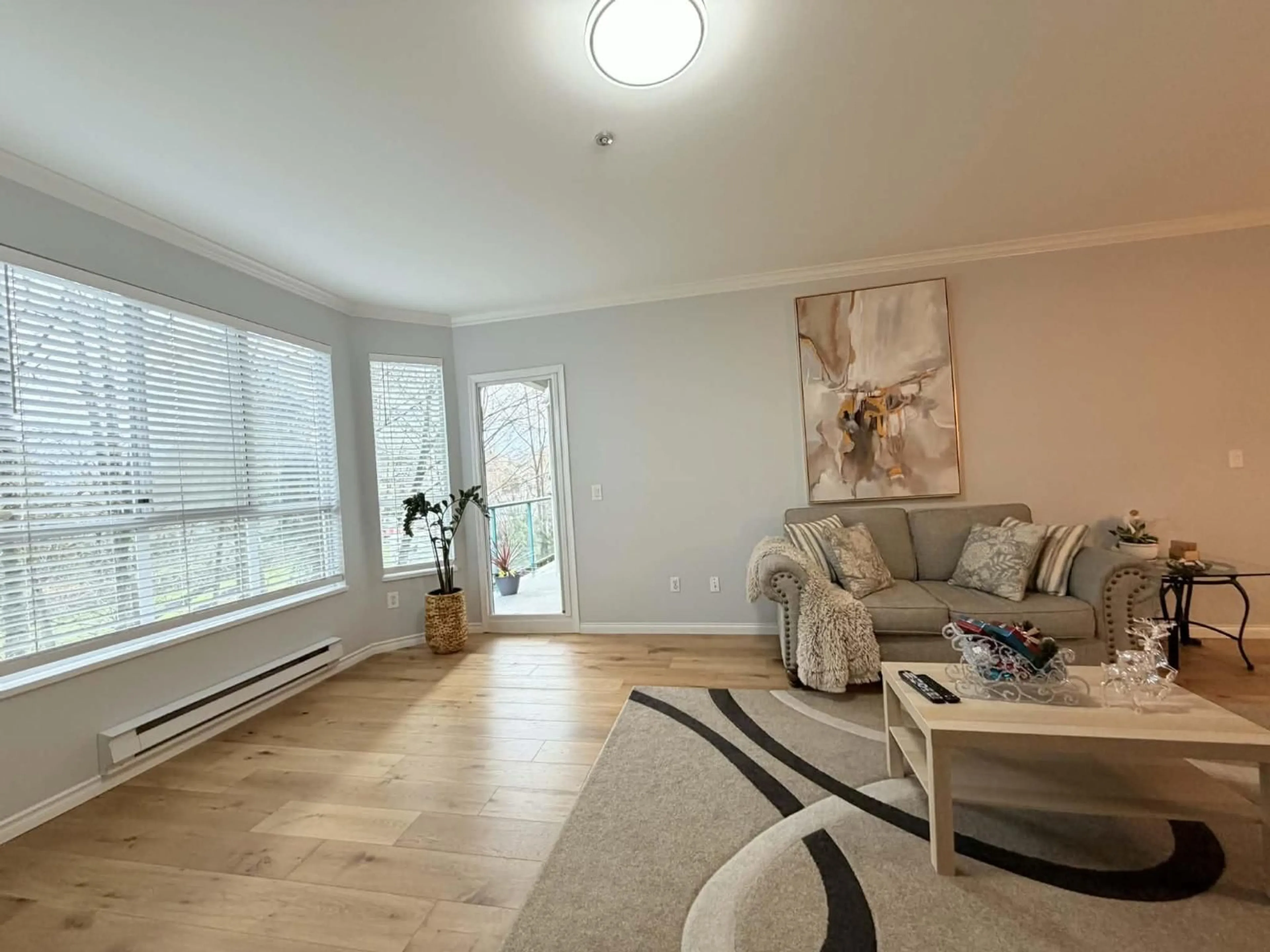 Living room with furniture, wood/laminate floor for 304 - 5646 200 STREET, Langley British Columbia V3A1M8