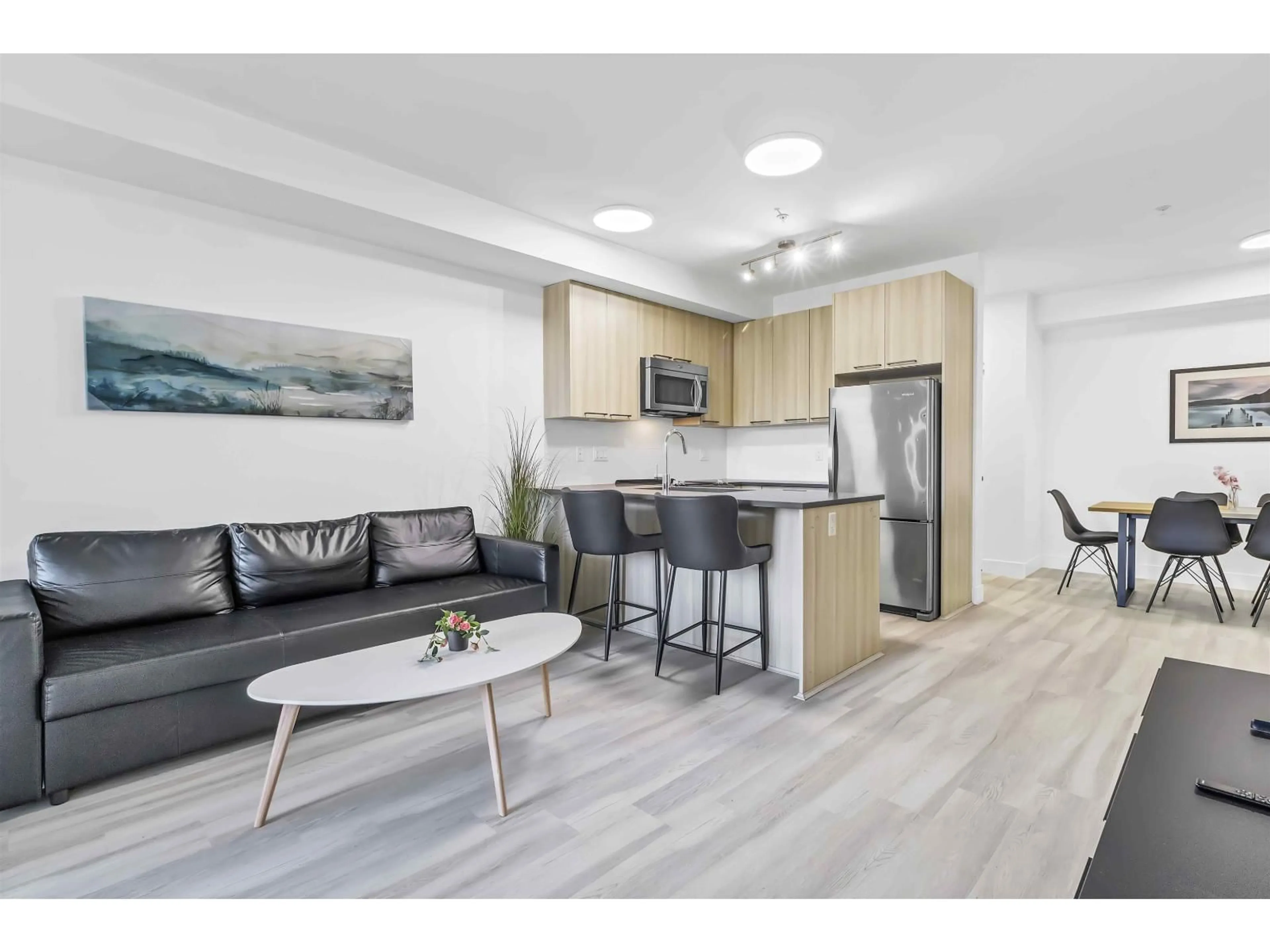 Open concept kitchen, wood/laminate floor for 101 - 15628 104 AVENUE, Surrey British Columbia V4N2J3