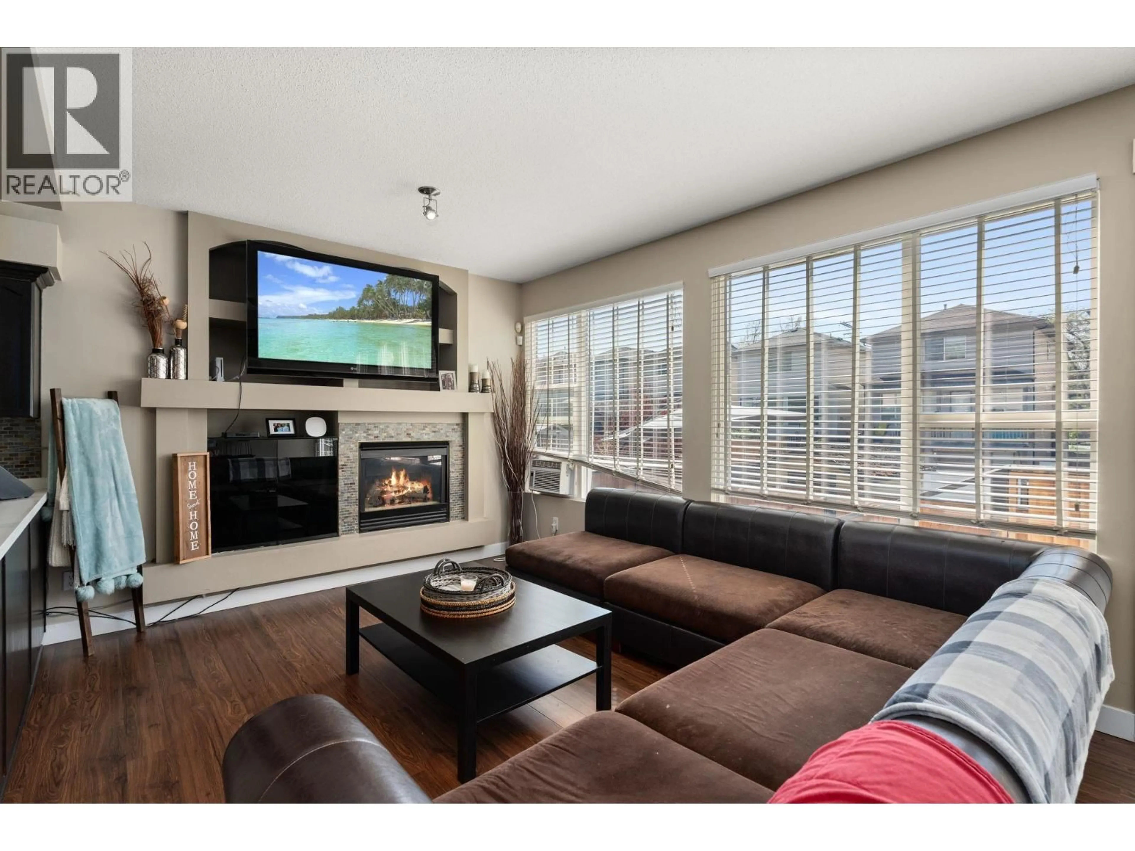 Living room with furniture, wood/laminate floor for 24280 102A AVENUE, Maple Ridge British Columbia V2W1X8
