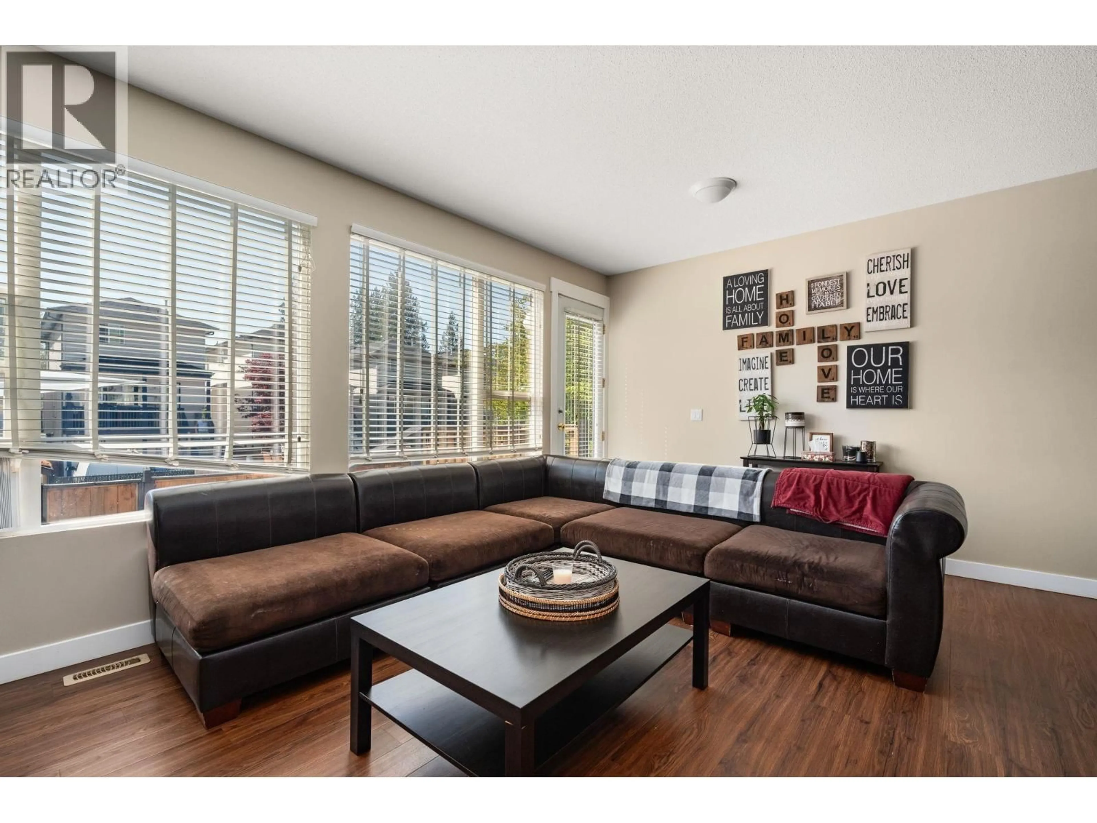 Living room with furniture, wood/laminate floor for 24280 102A AVENUE, Maple Ridge British Columbia V2W1X8