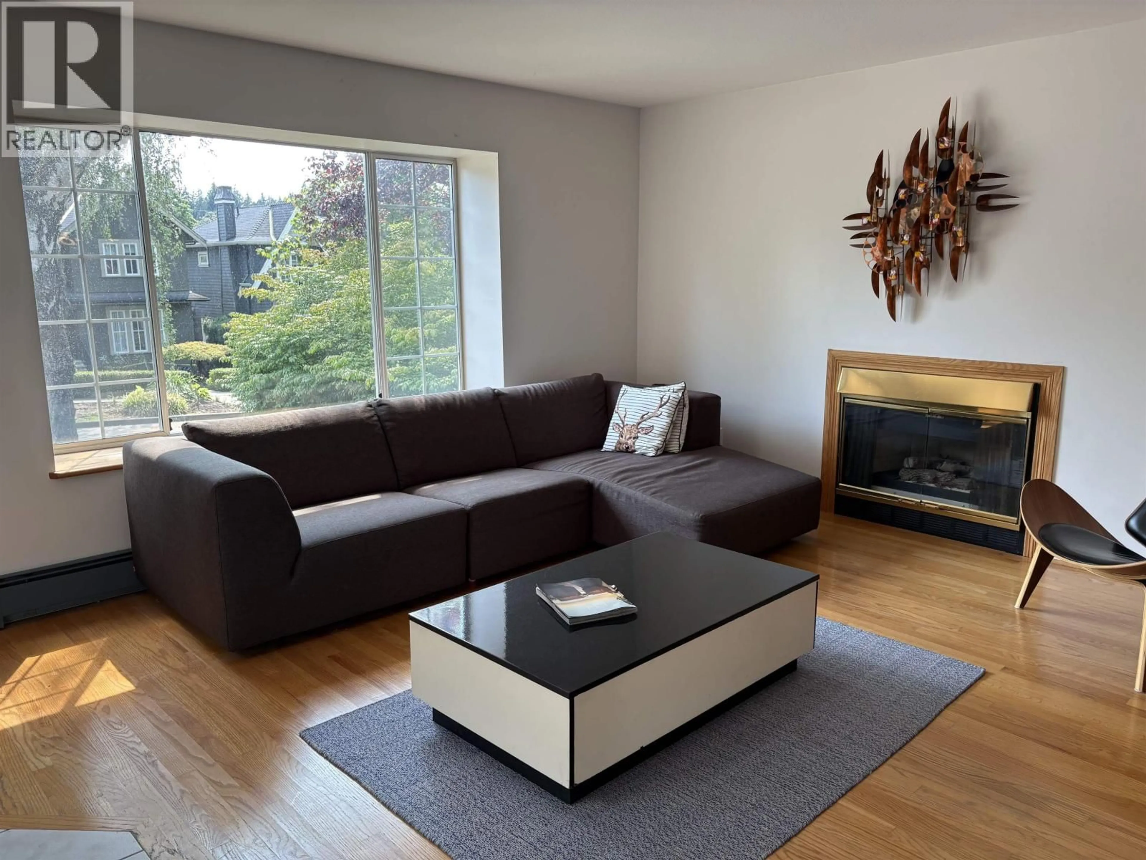 Living room with furniture, wood/laminate floor for 4227 14TH AVENUE, Vancouver British Columbia V6R2X7