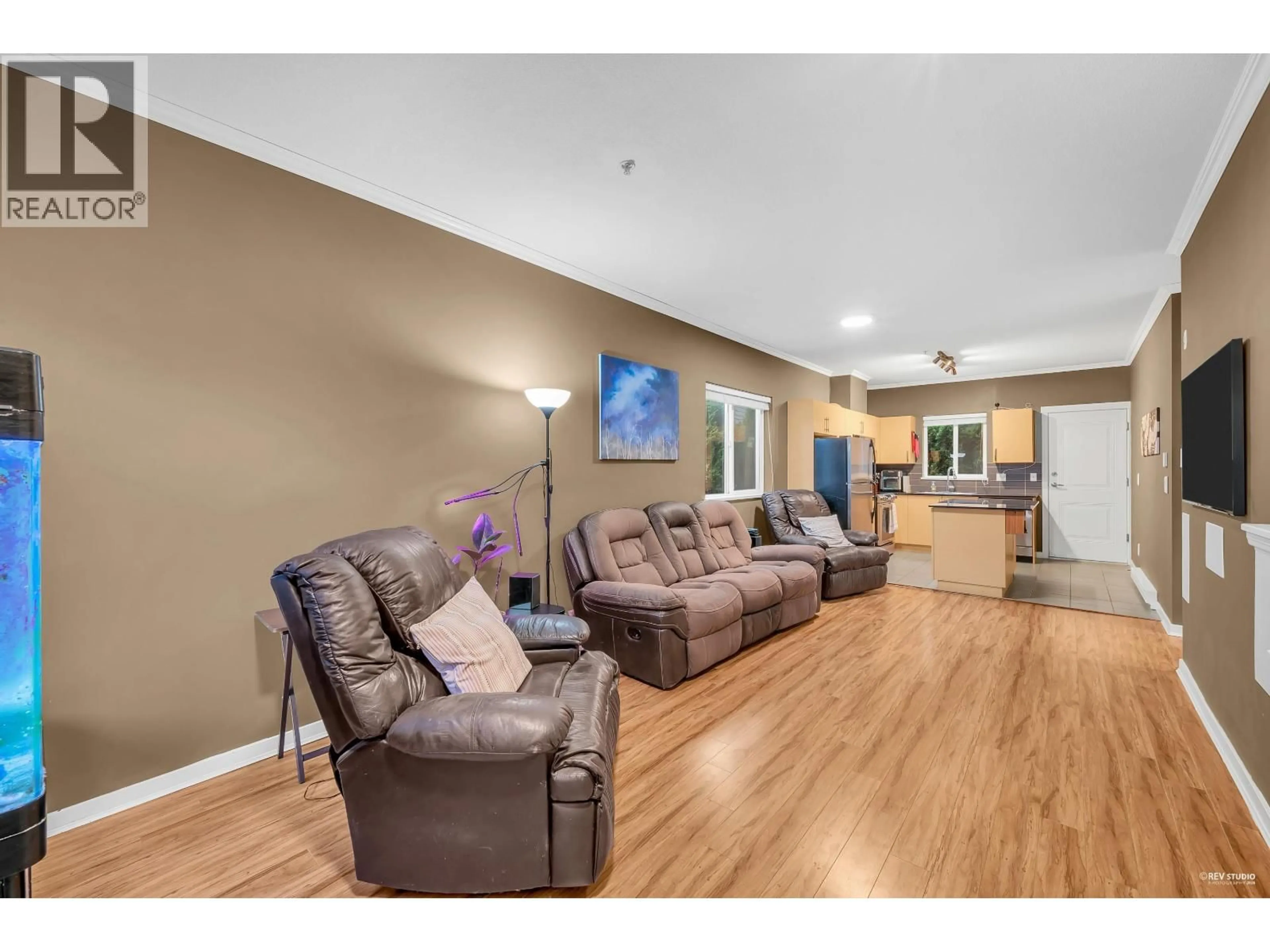 Living room with furniture, wood/laminate floor for 310 - 1661 FRASER AVENUE, Port Coquitlam British Columbia V3B0B6