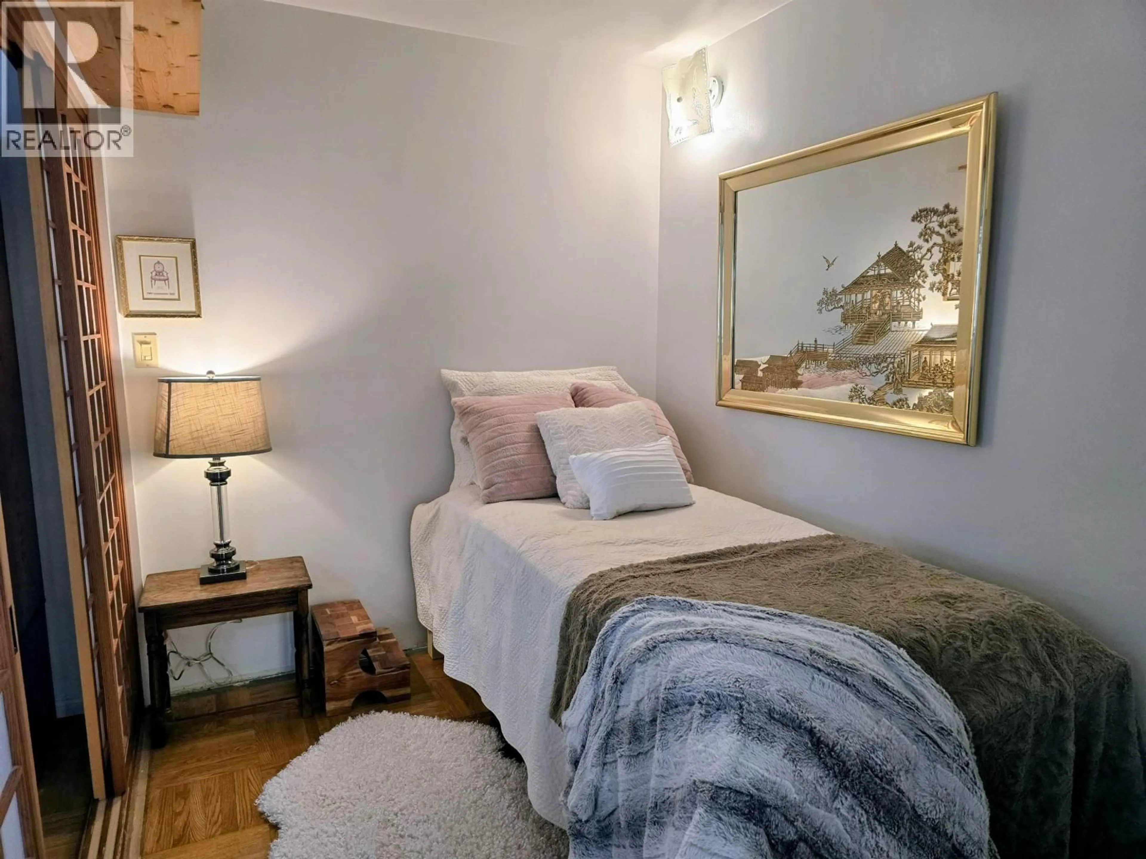 Bedroom with bed, wood/laminate floor for 106 - 1879 BARCLAY STREET, Vancouver British Columbia V6G1K7