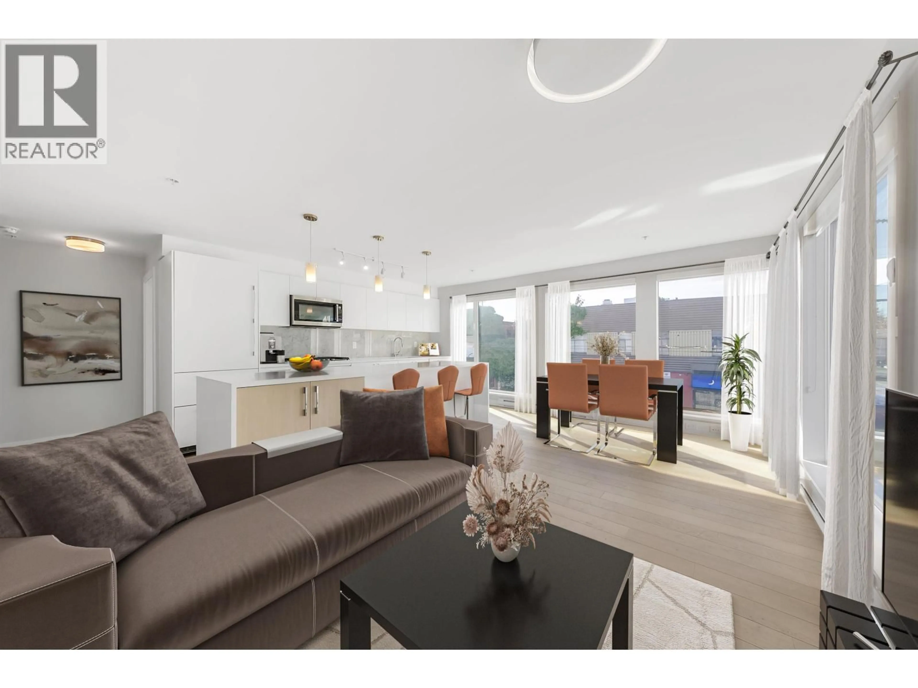 Living room with furniture, unknown for 202 - 2508 FRASER STREET, Vancouver British Columbia V5T3V4