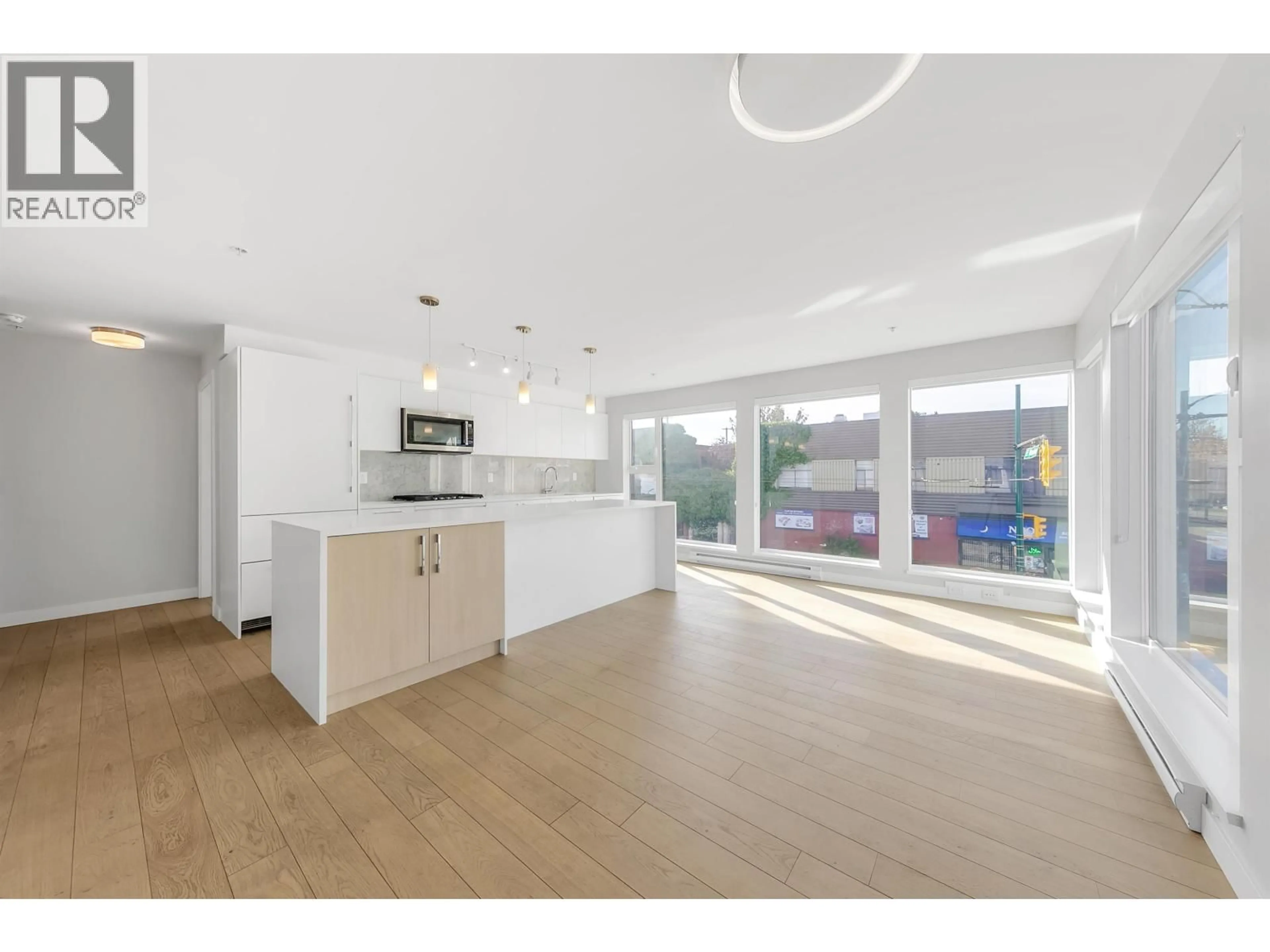 Open concept kitchen, unknown for 202 - 2508 FRASER STREET, Vancouver British Columbia V5T3V4